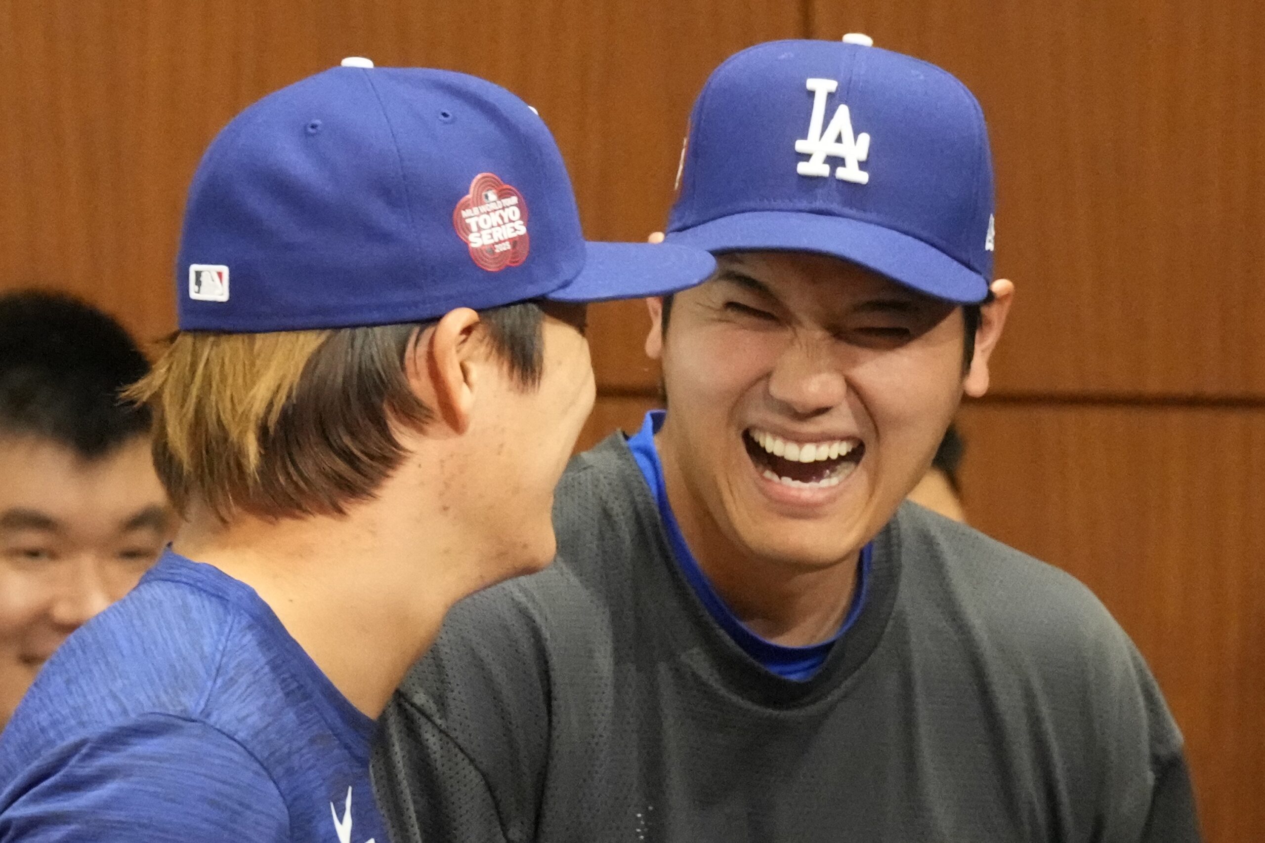 Dodgers pitcher Yoshinobu Yamamoto, left, two-way player Shohei Ohtani, right,...