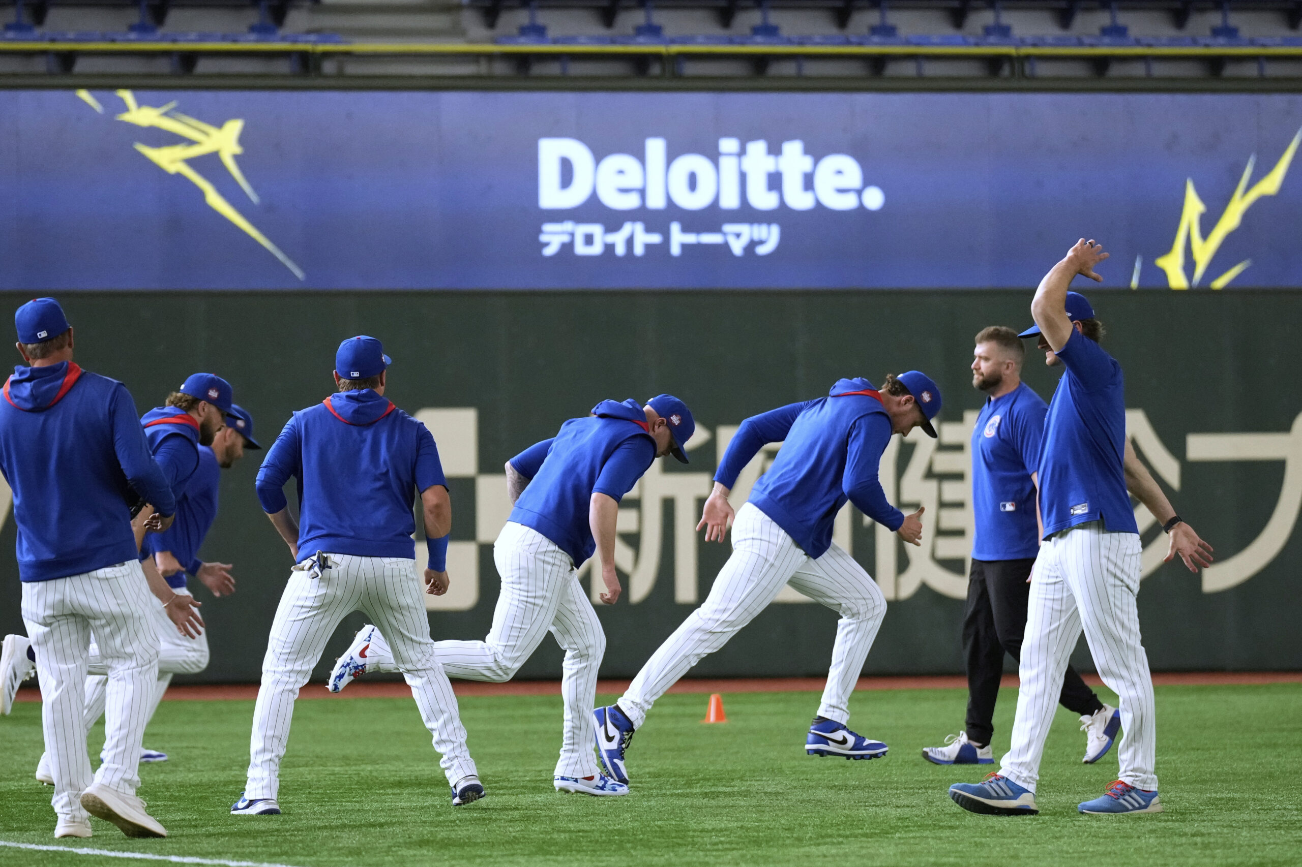 Chicago Cubs players participate in a training session at Tokyo...