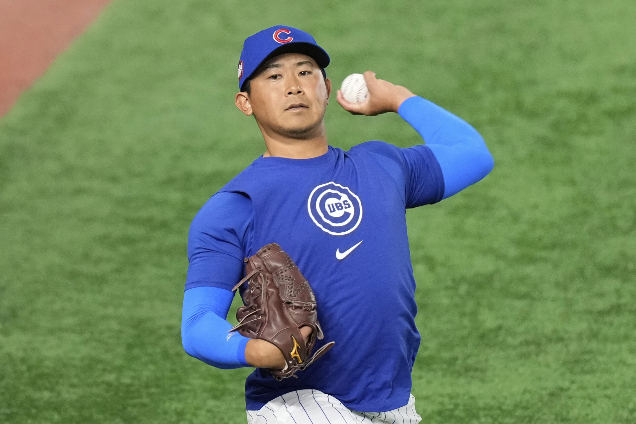 Chicago Cubs pitcher Shota Imanaga participates in a training session...