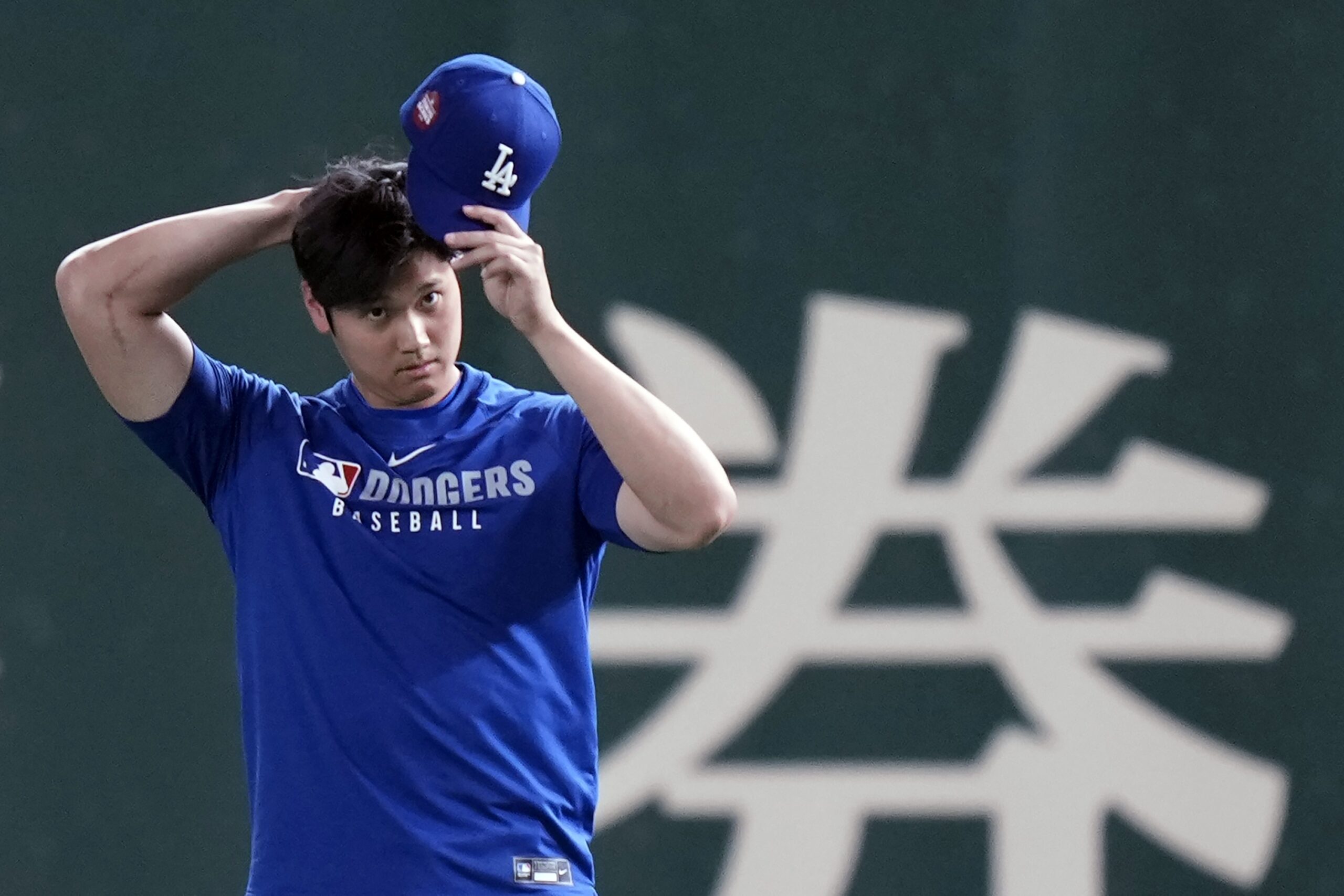 Dodgers star Shohei Ohtani warms up during the official training,...