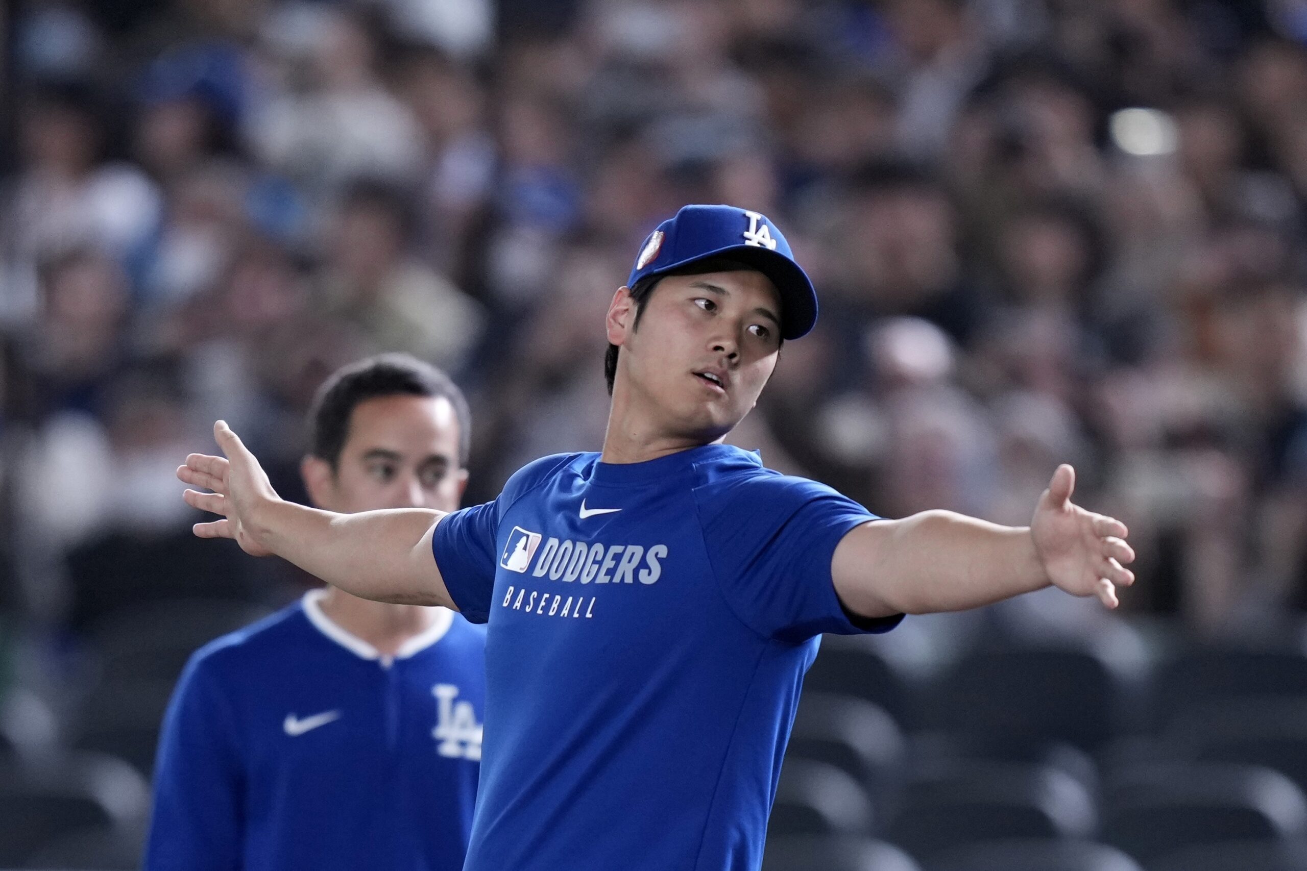 Dodgers star Shohei Ohtani warms up during the official training,...