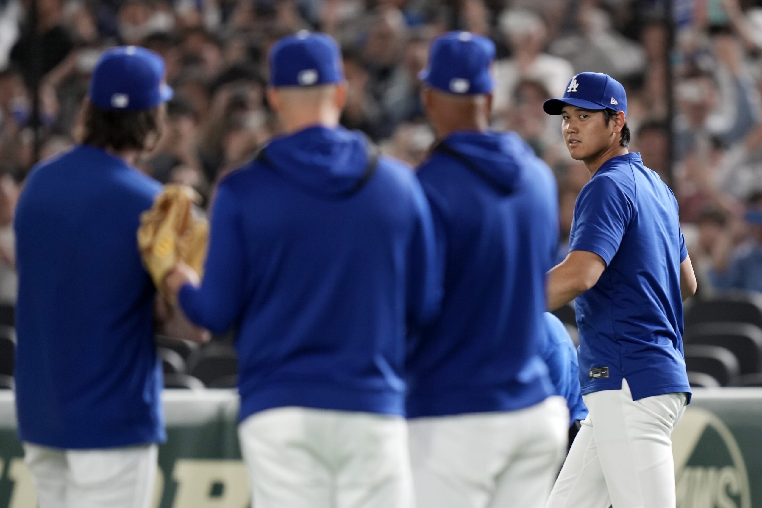 Dodgers star Shohei Ohtani, right, joins the official training, Friday,...