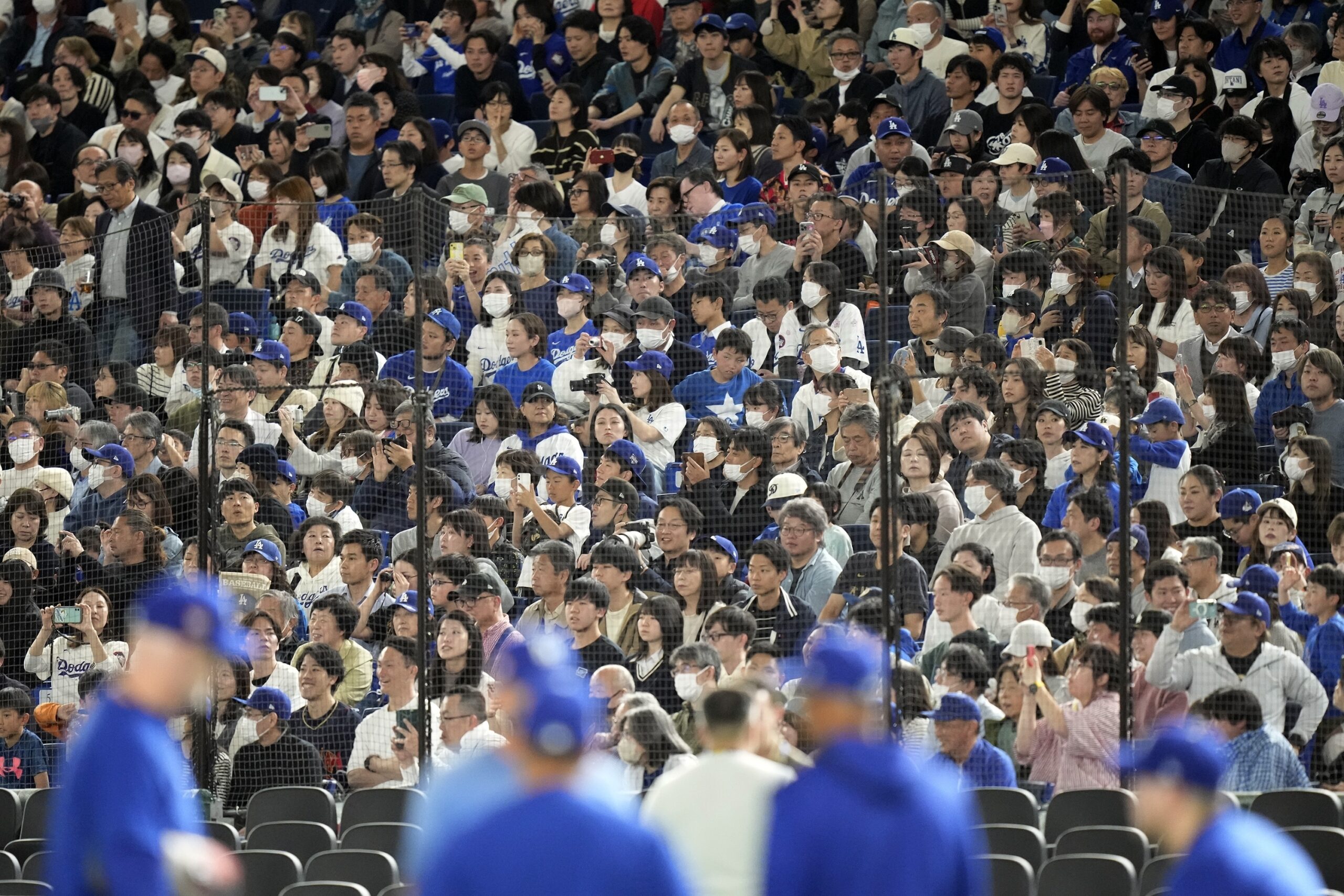 More than 10,000 fans watch as the Dodgers work out...