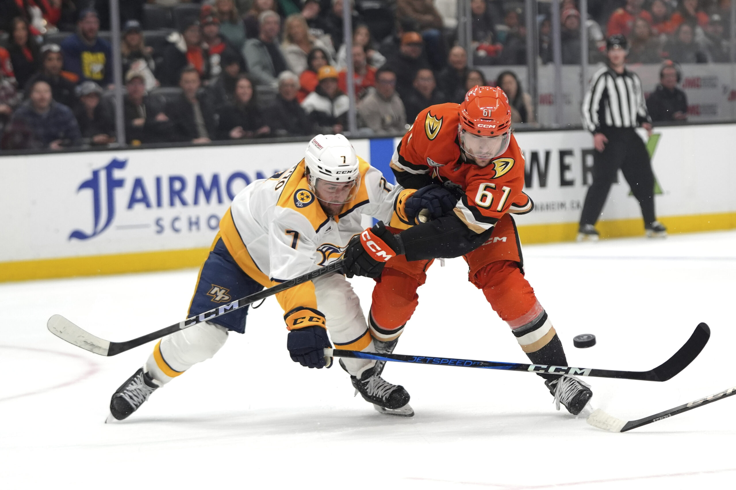 Ducks left wing Cutter Gauthier, right, is defended by Nashville...