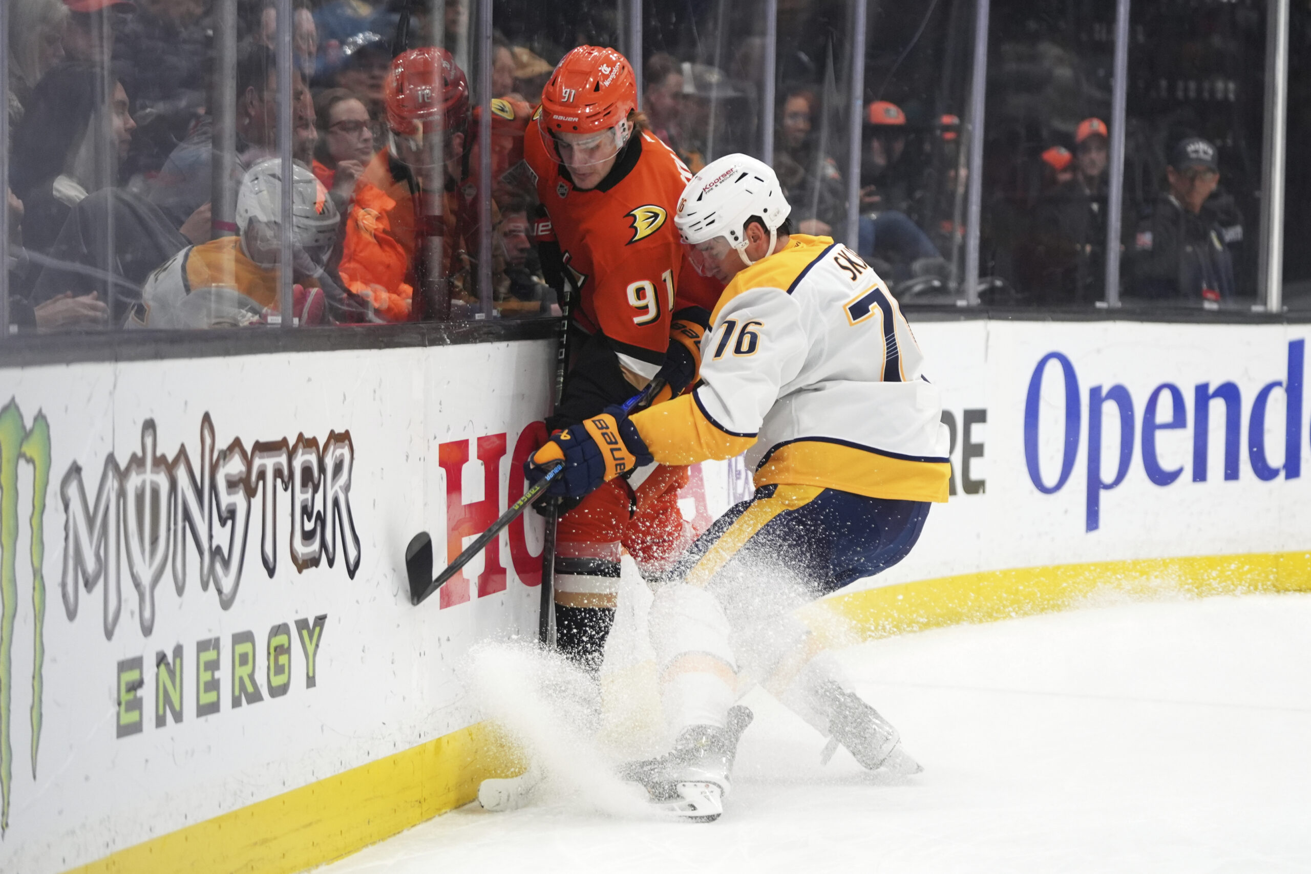 Ducks center Leo Carlsson (91) is shoved by Nashville Predators...