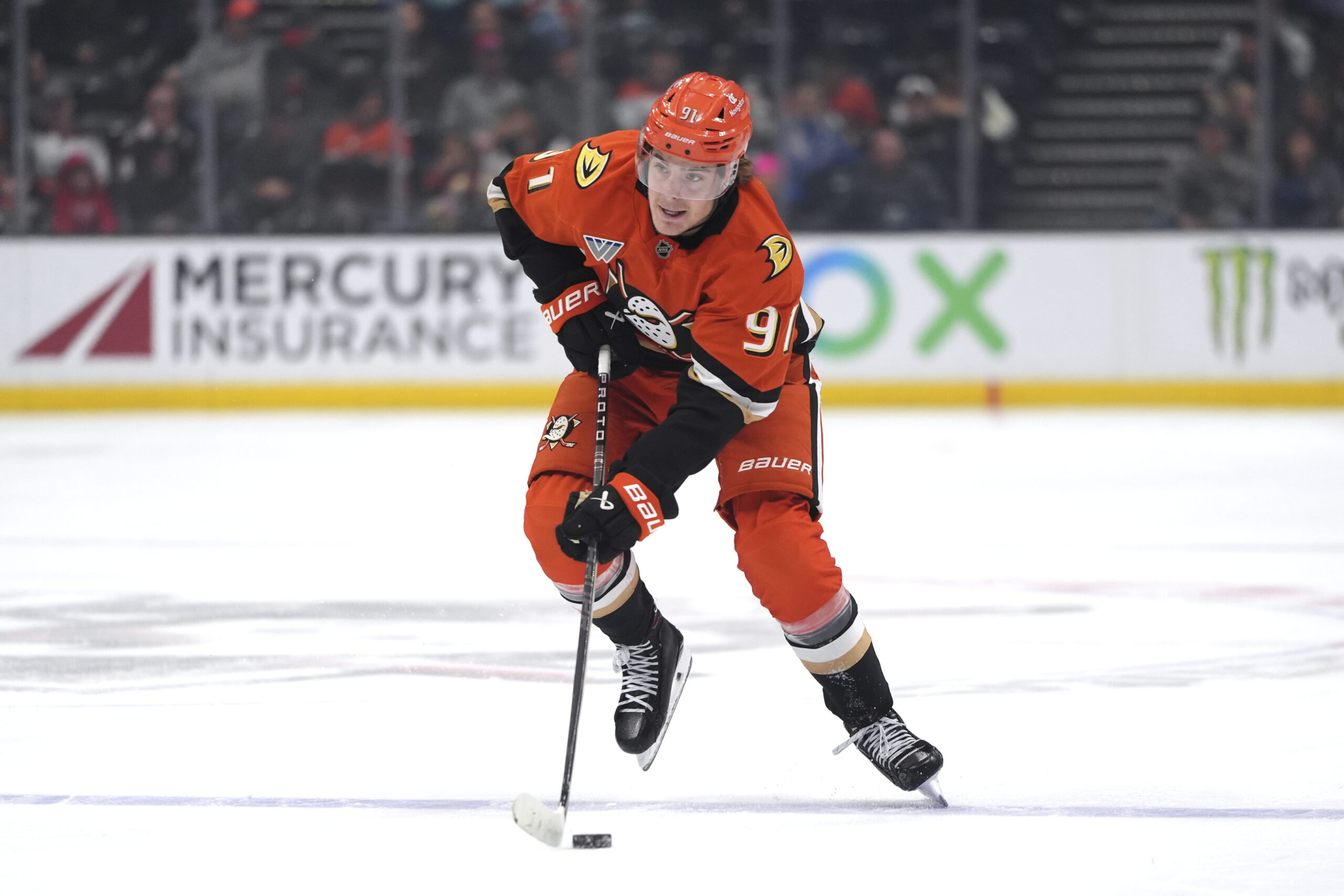 Ducks center Leo Carlsson moves the puck during the first...