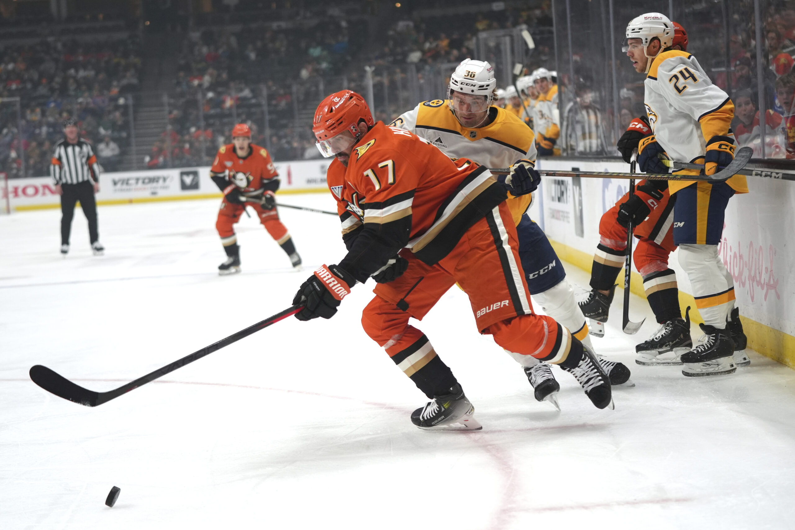 Ducks left wing Alex Killorn moves the puck under defense...