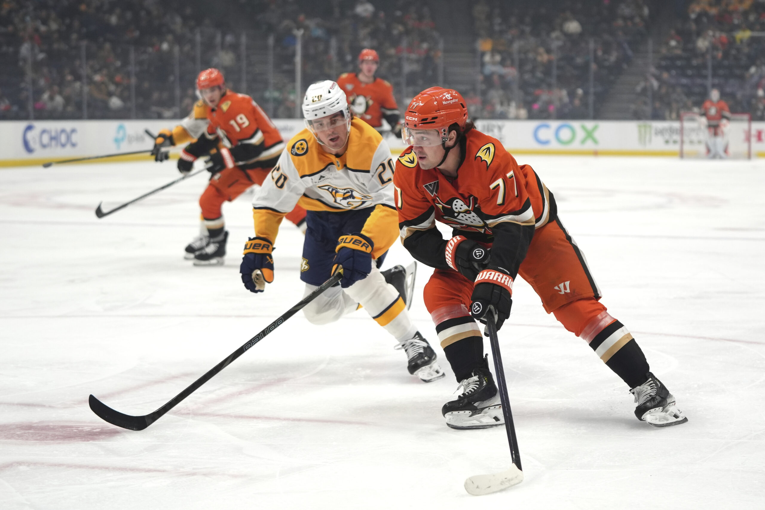 Ducks right wing Frank Vatrano (77) moves the puck past...