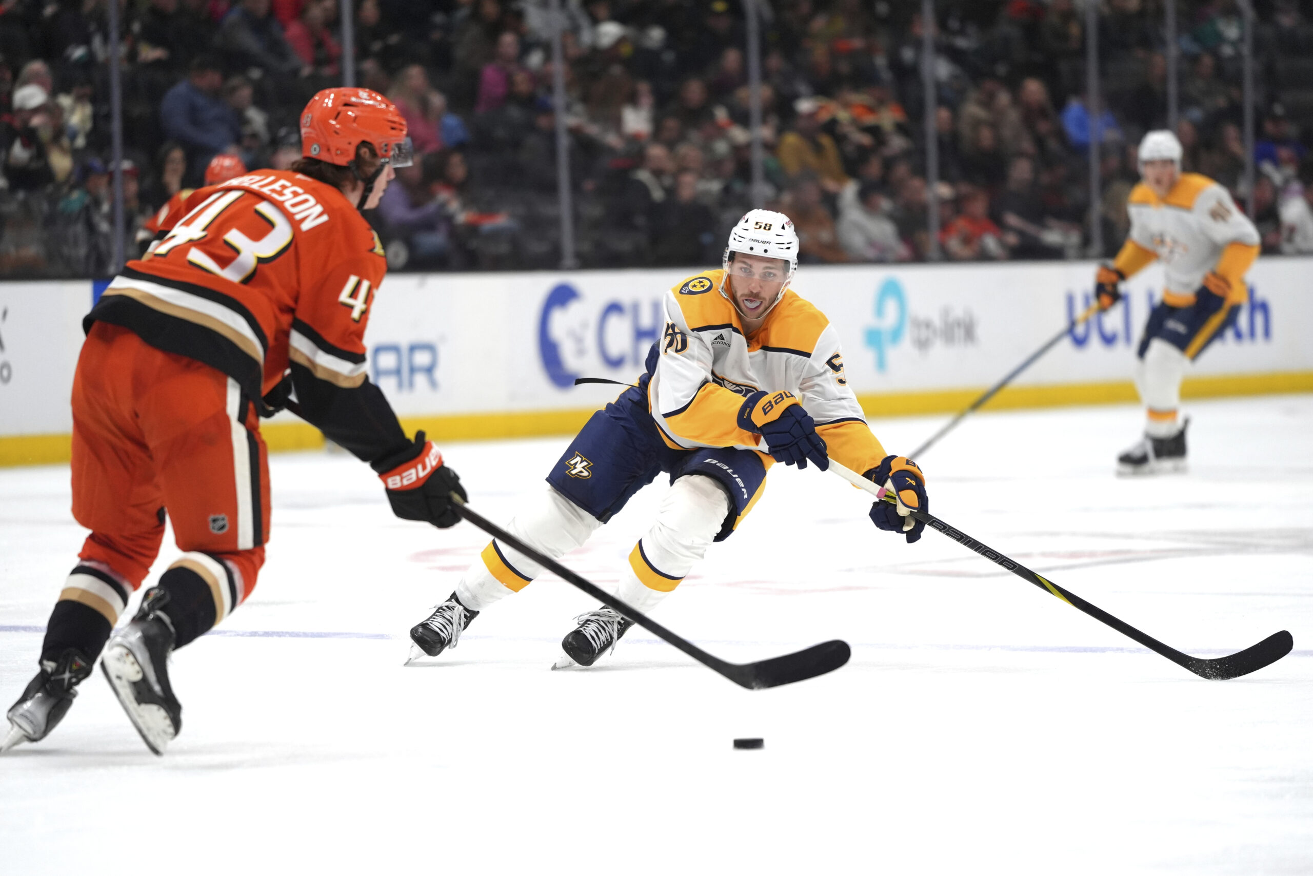 Nashville Predators left wing Michael Bunting (58) pressures Ducks defenseman...