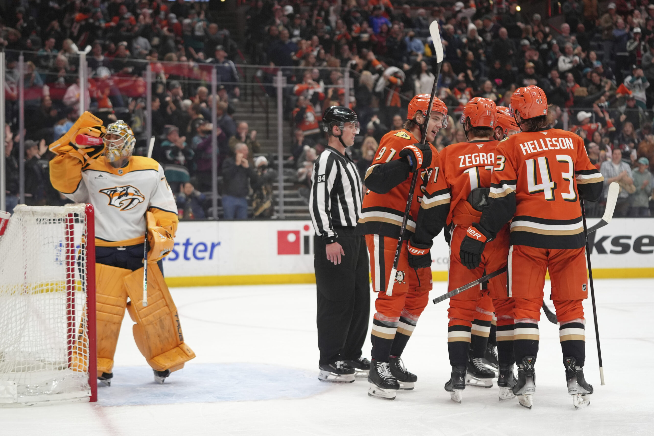 Ducks players celebrate a tiebreaking goal by Alex Killorn in...