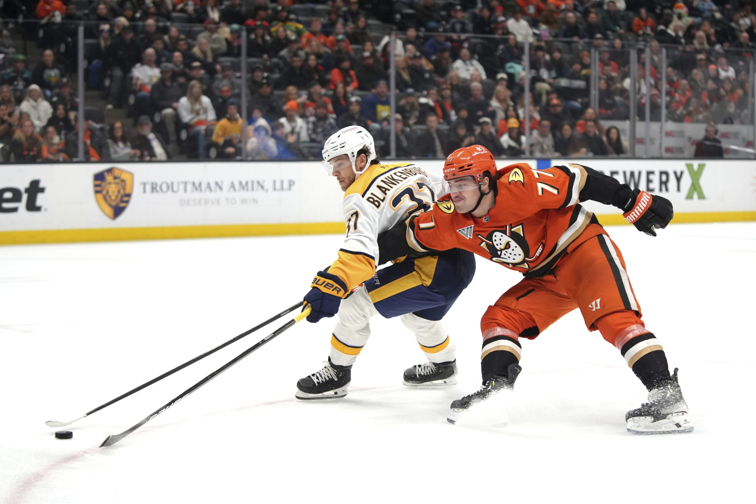 Ducks right wing Frank Vatrano (77) is defended by Nashville...