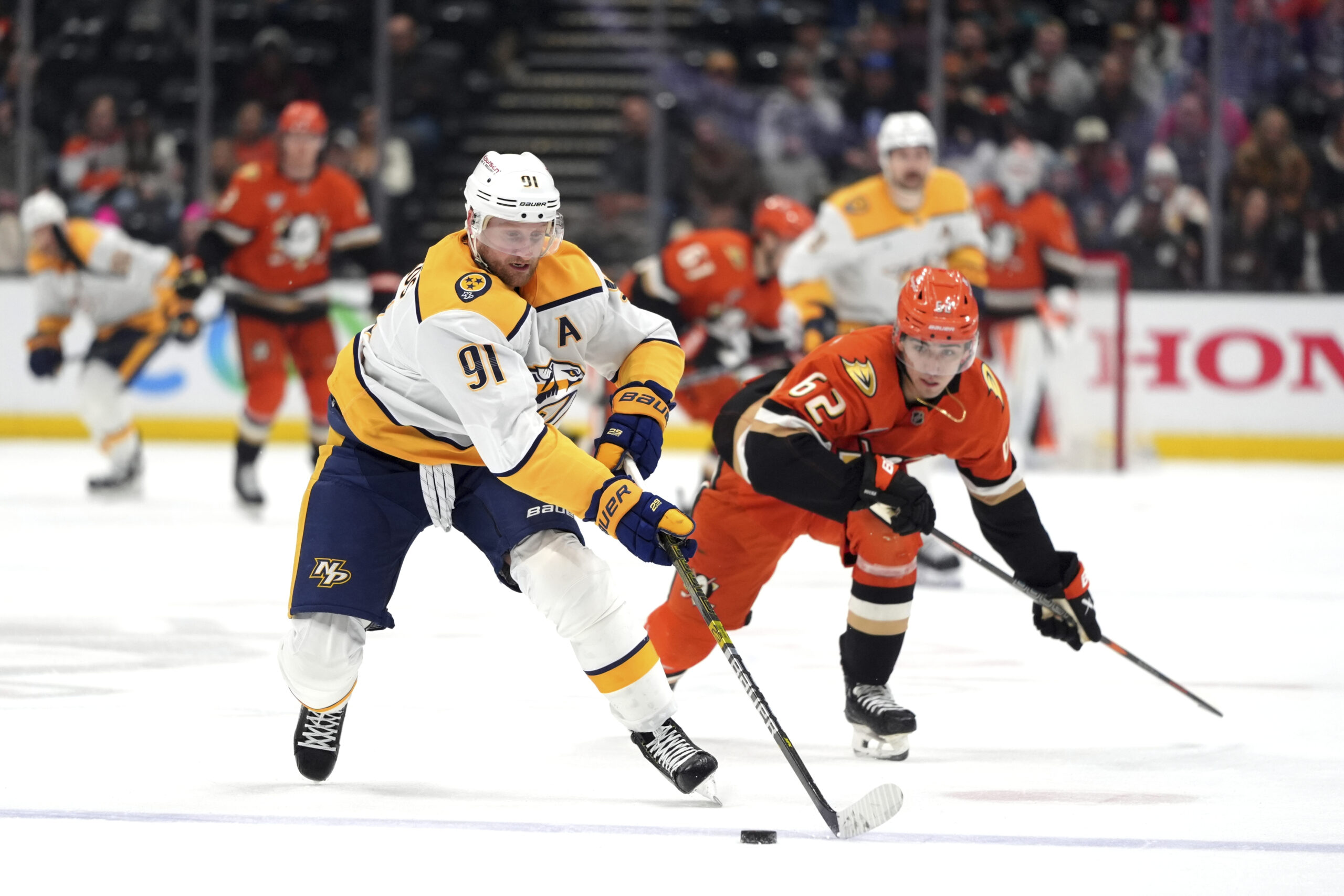 Nashville Predators center Steven Stamkos (91) moves the puck past...