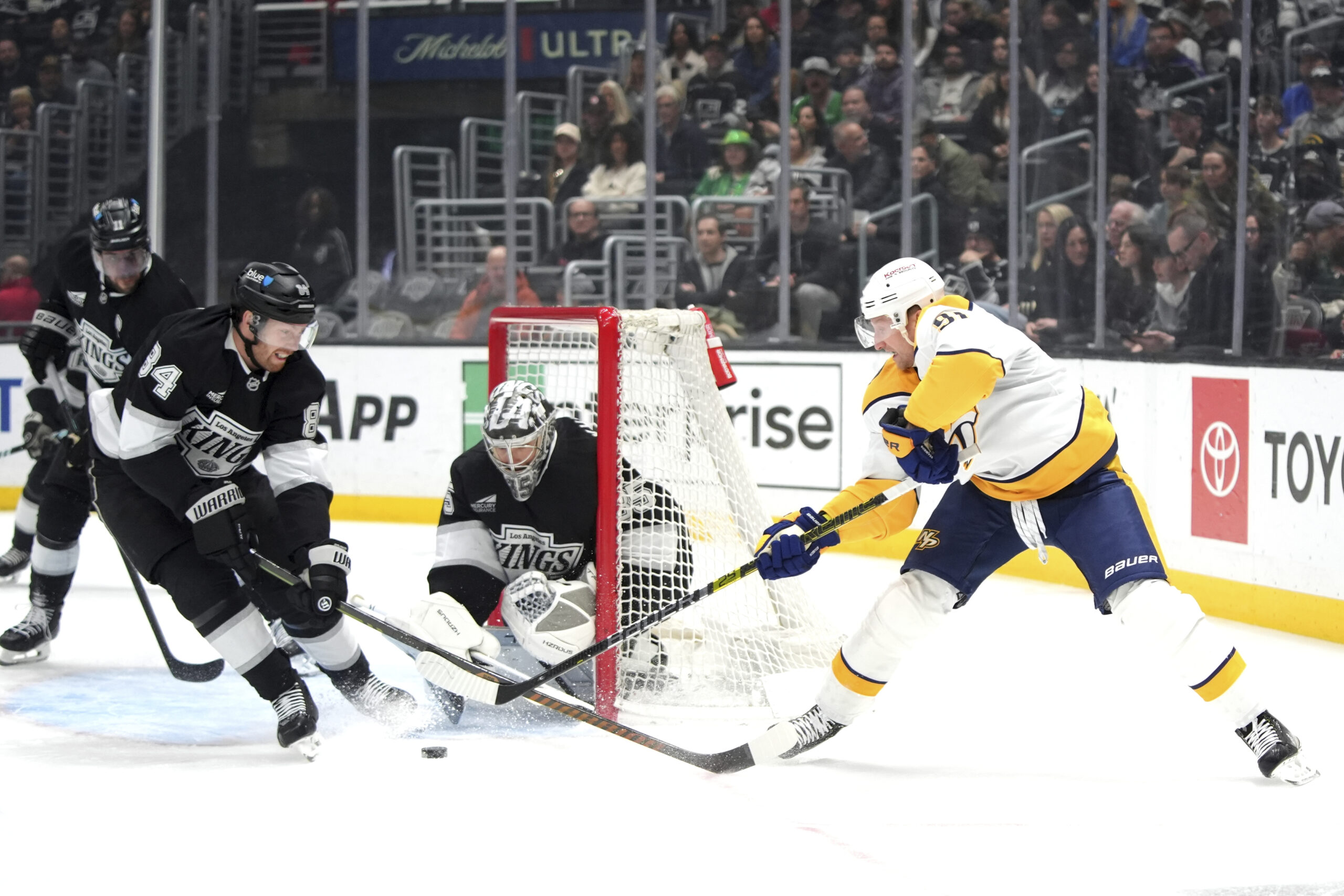 Nashville Predators center Steven Stamkos (91) is defended by Kings...