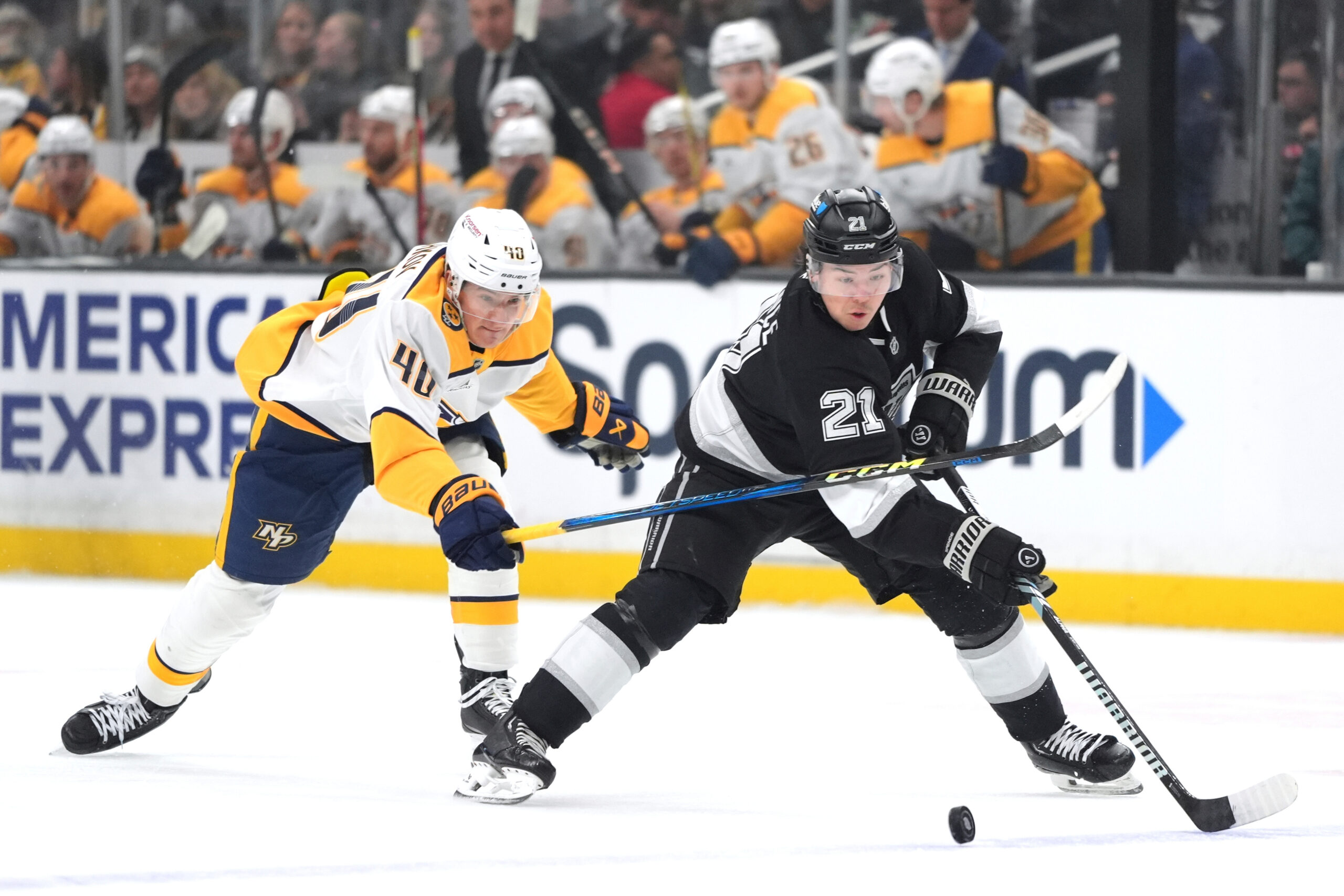 Kings defenseman Jordan Spence (21) moves the puck past Nashville...