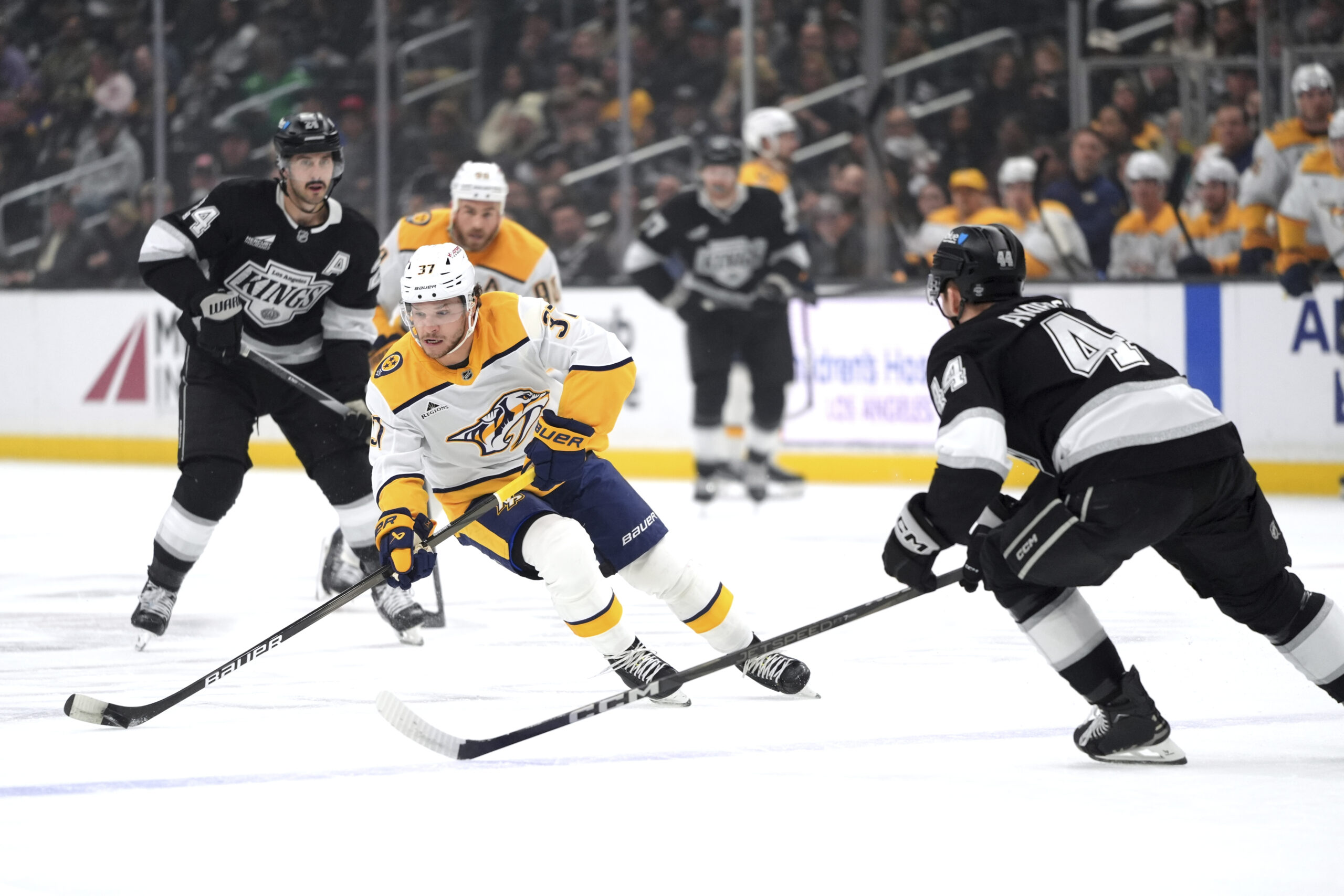 Nashville Predators defenseman Nick Blankenburg (37) moves the puck under...