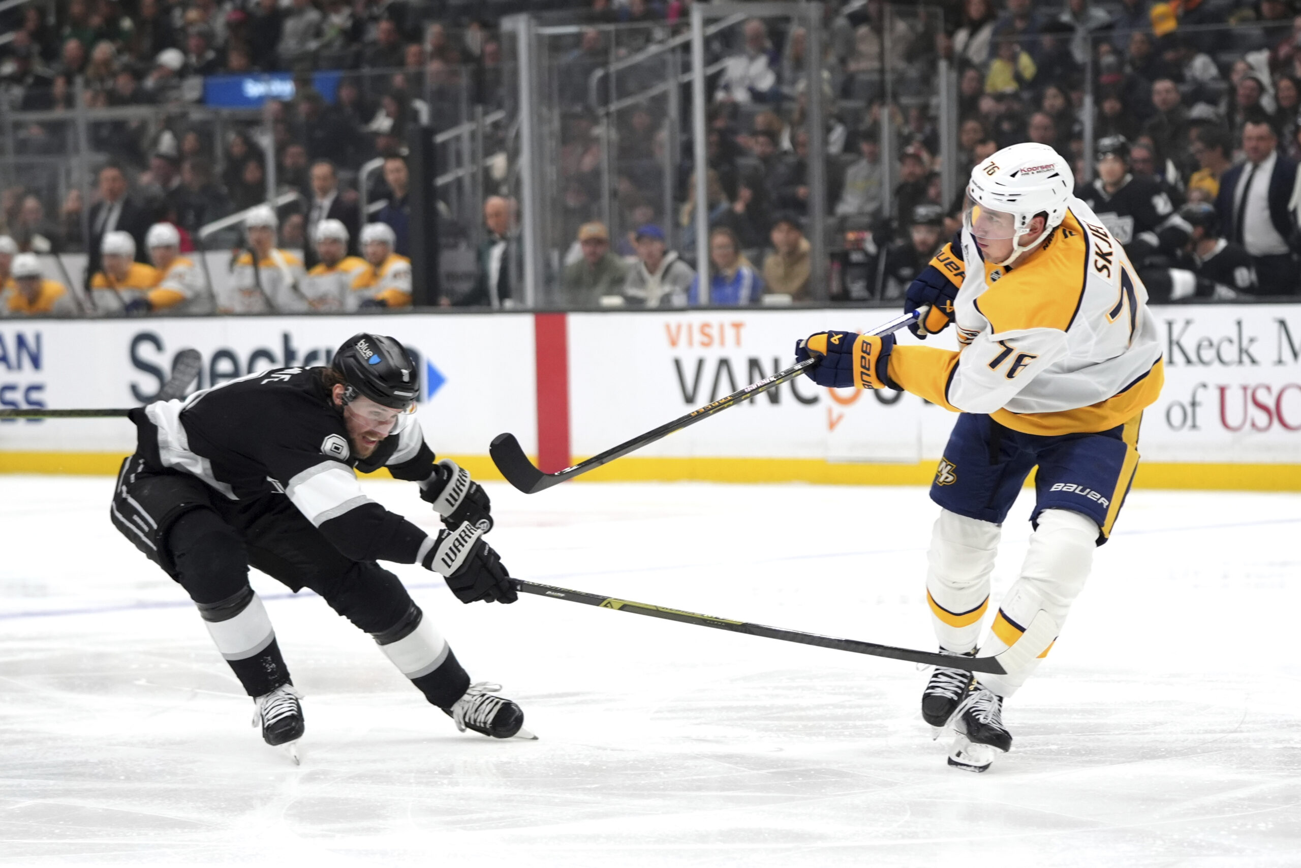 Kings right wing Adrian Kempe (9) pressures Nashville Predators defenseman...