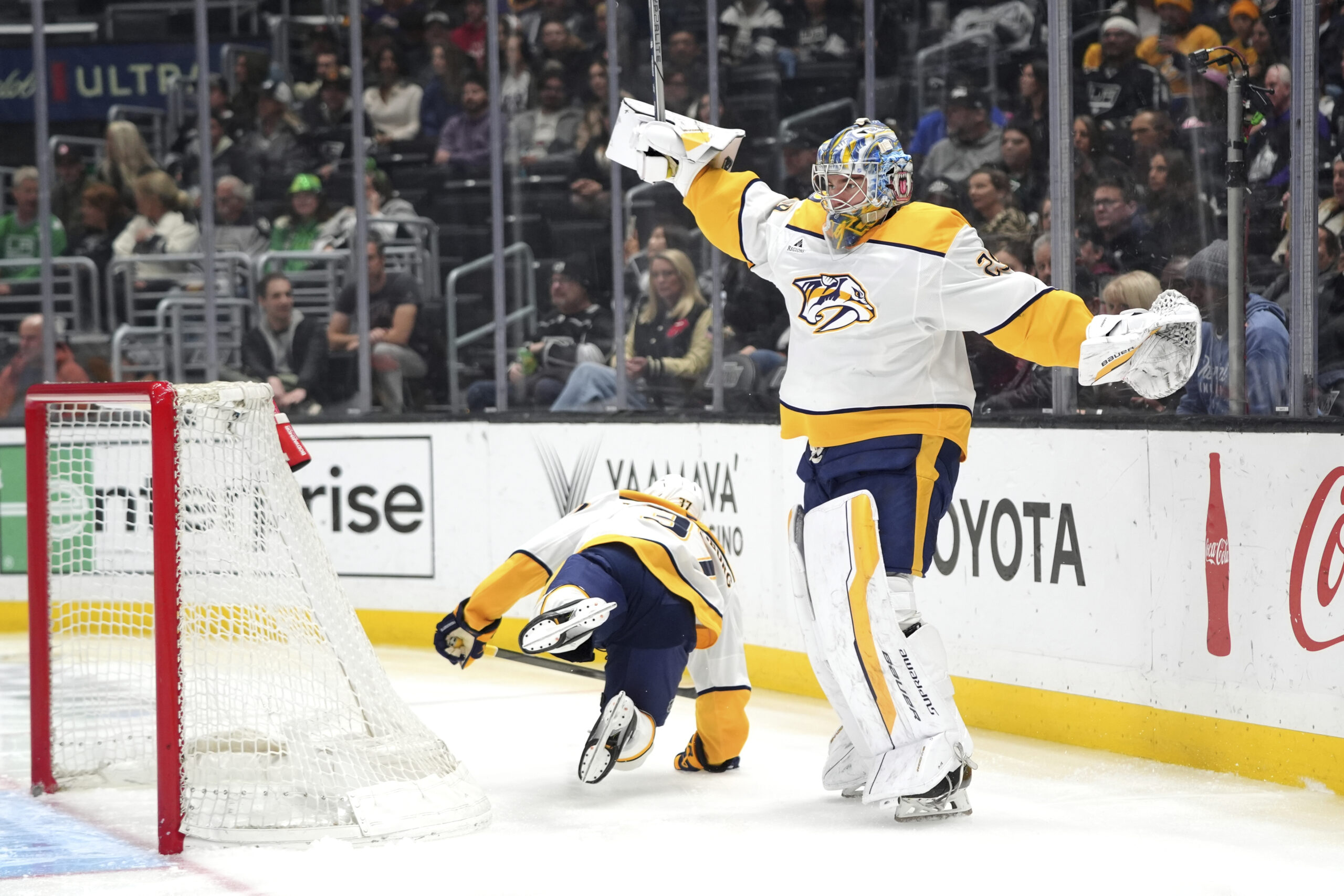 Nashville Predators defenseman Nick Blankenburg (37) falls as he skates...