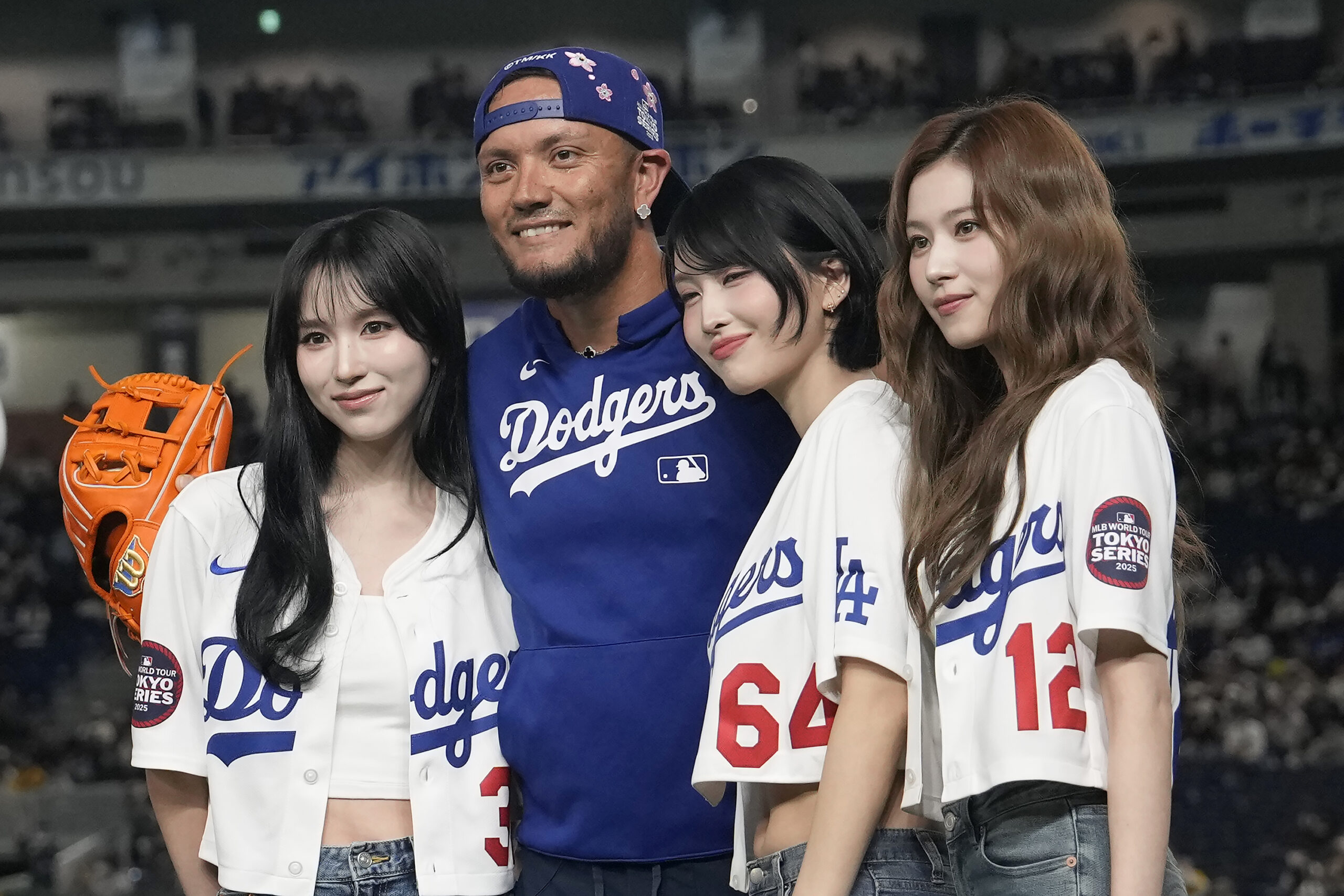 Dodgers infielder Miguel Rojas poses for photos with members of...