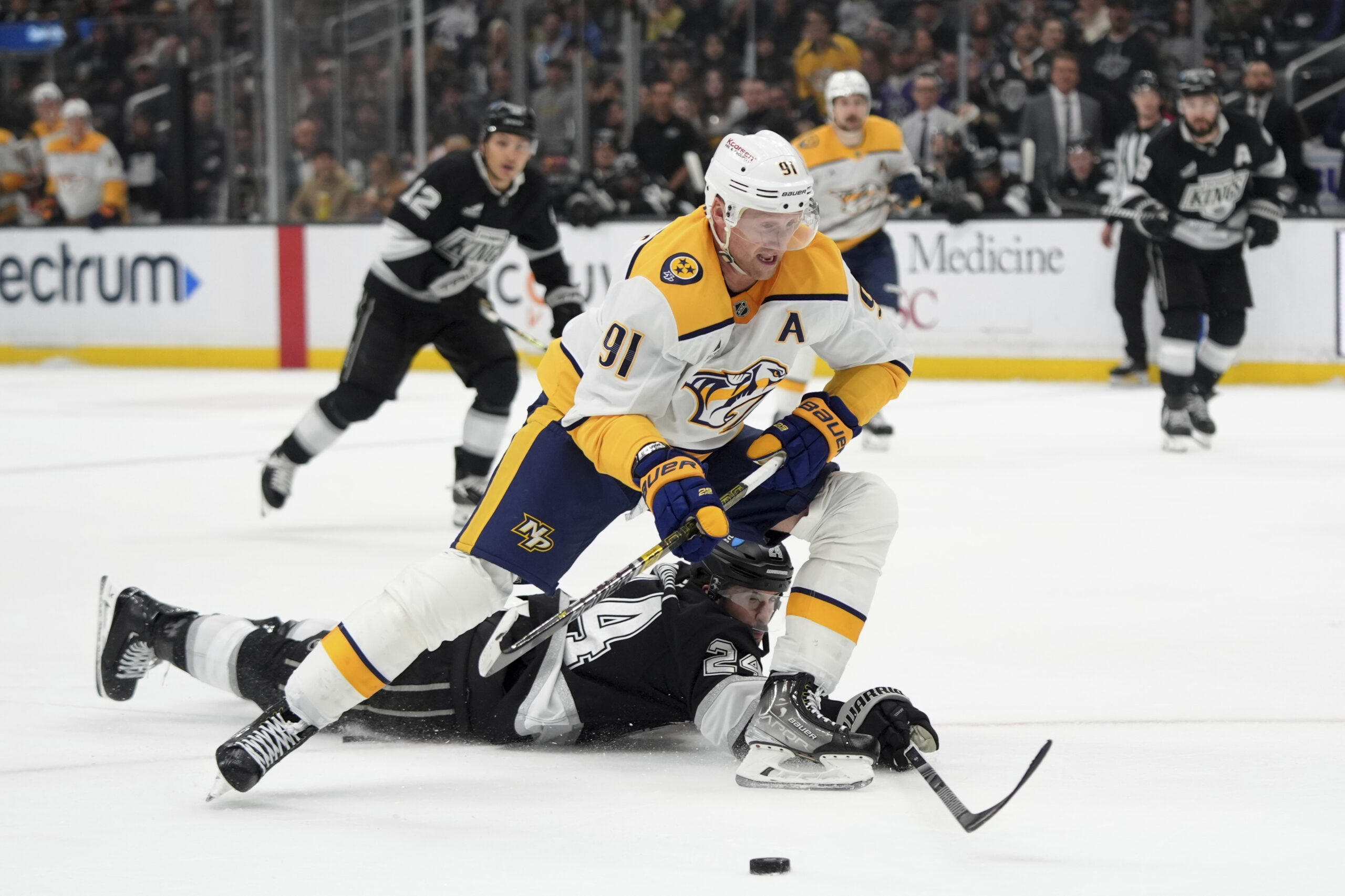 Nashville Predators center Steven Stamkos (91) moves the puck under...