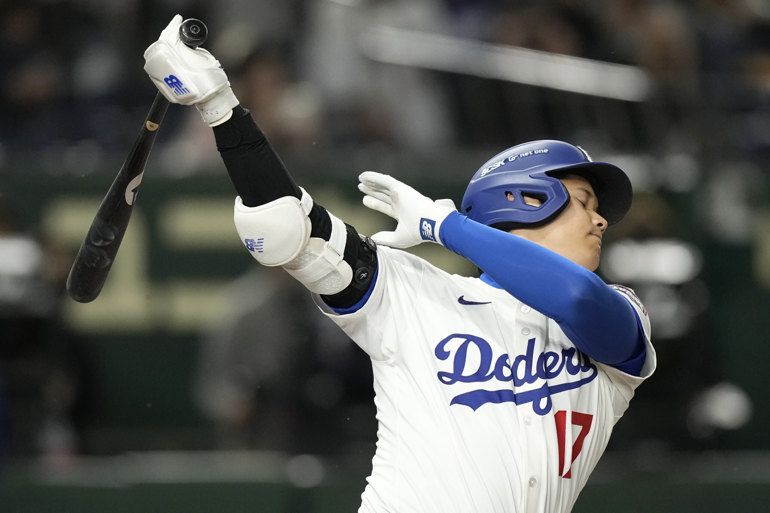 Dodgers star Shohei Ohtani reacts after striking out against the...