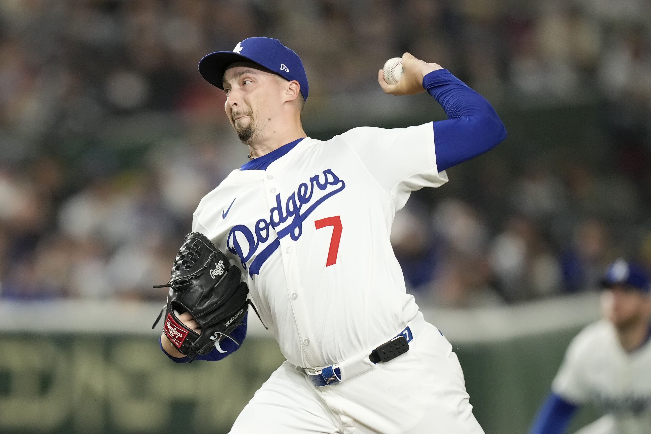 Dodgers starting pitcher Blake Snell throws to the plate during...