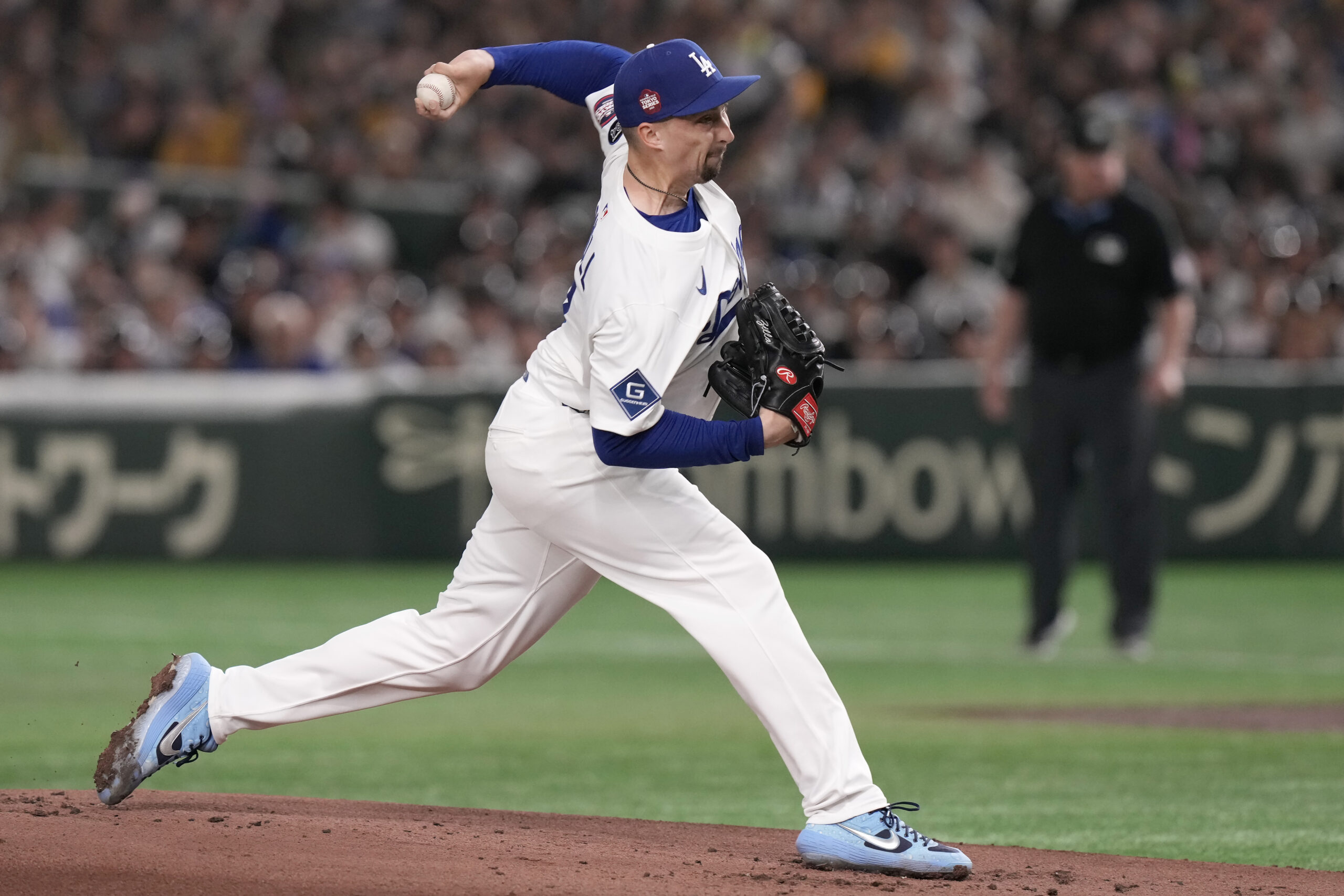 Dodgers starting pitcher Blake Snell works against the Hanshin Tigers...