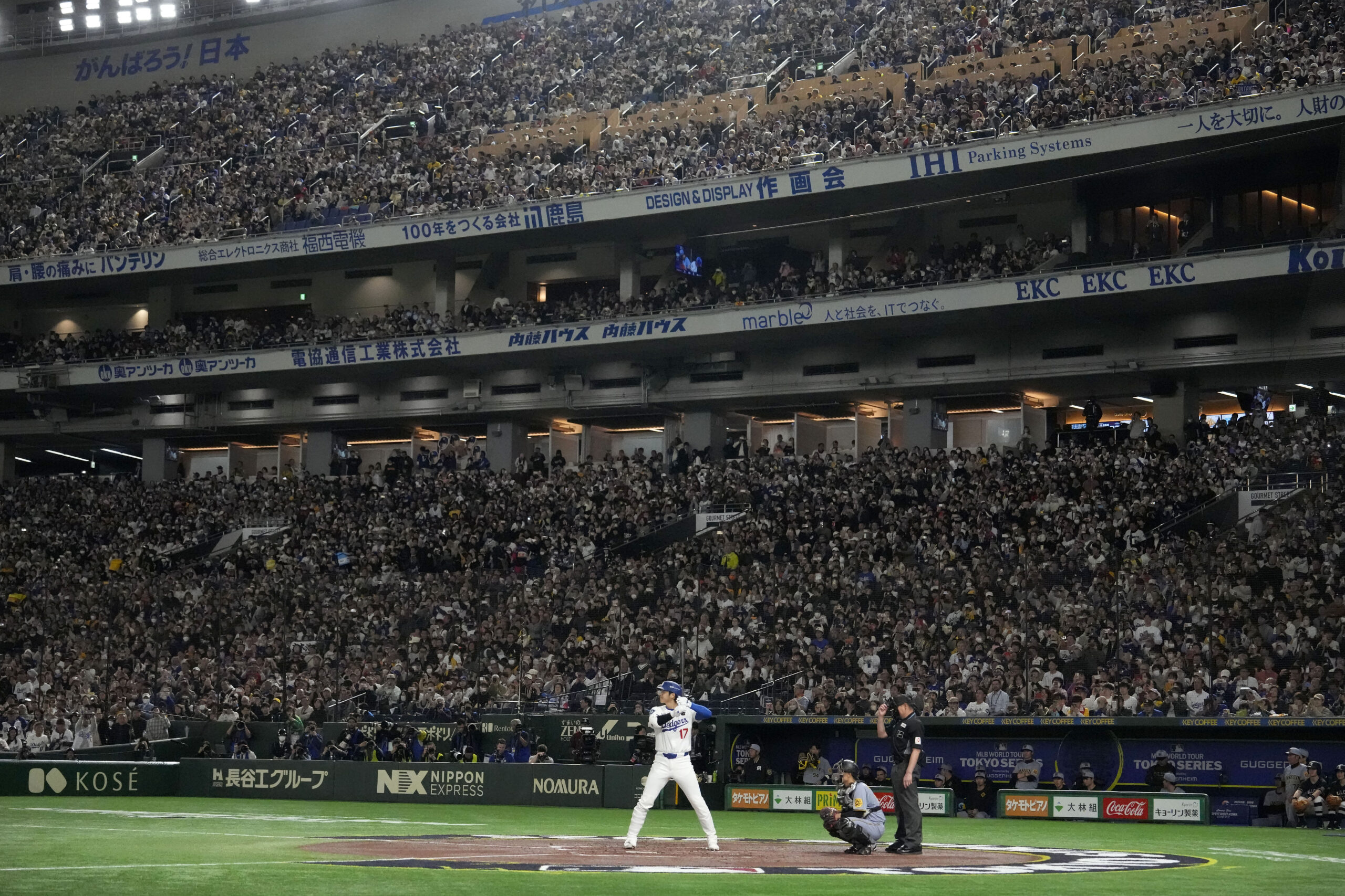 Dodgers star Shohei Ohtani, bottom center, bats against the Hanshin...