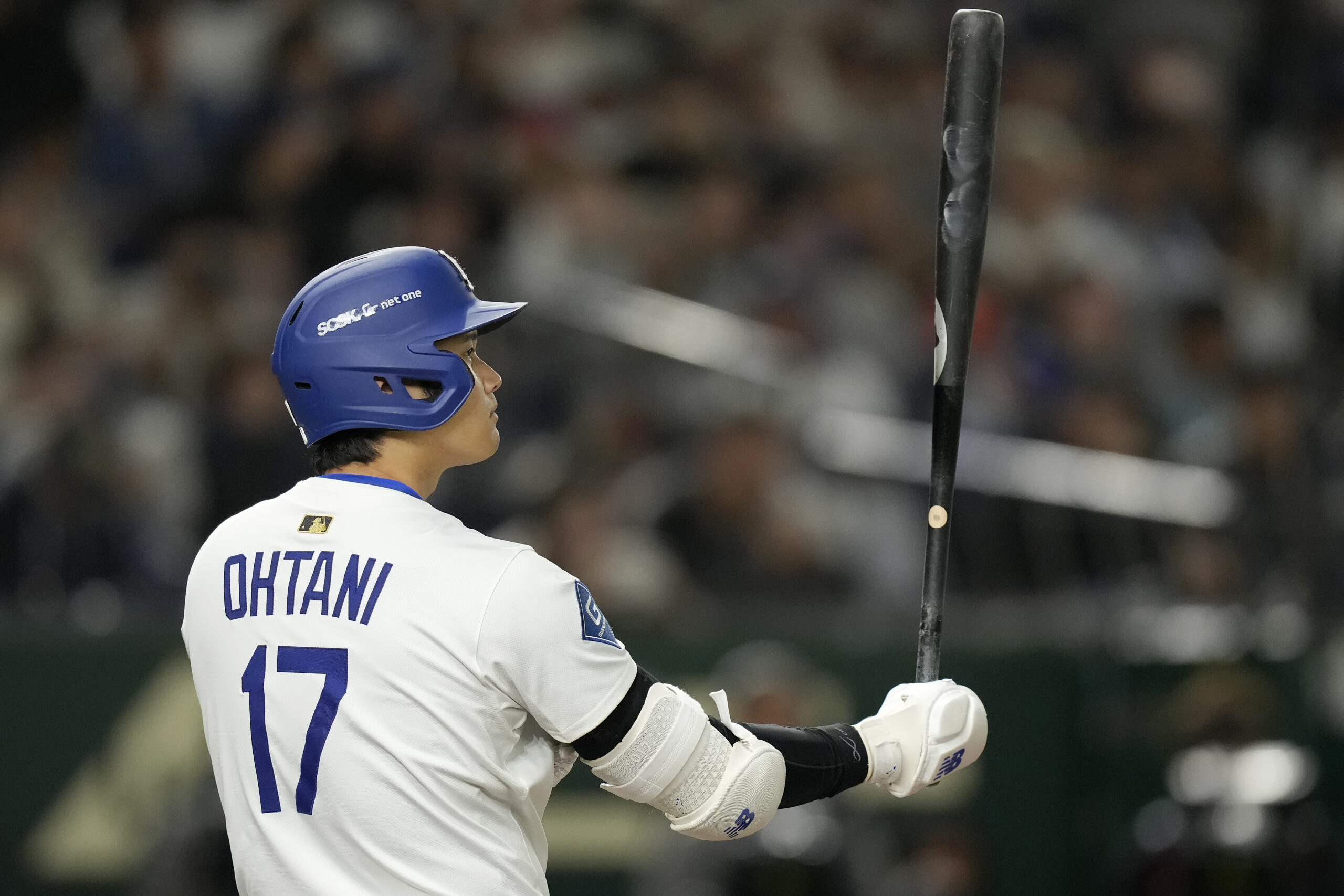 Dodgers star Shohei Ohtani bats against the Hanshin Tigers during...