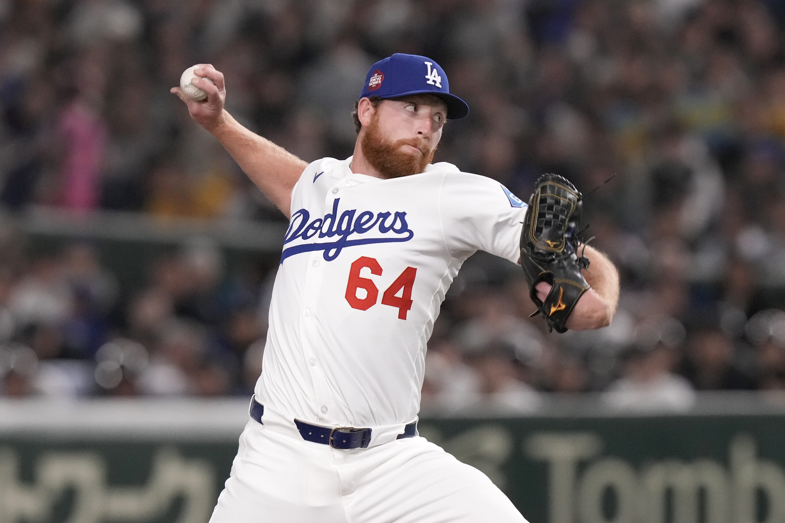 Dodgers relief pitcher Matt Sauer works against the Hanshin Tigers...