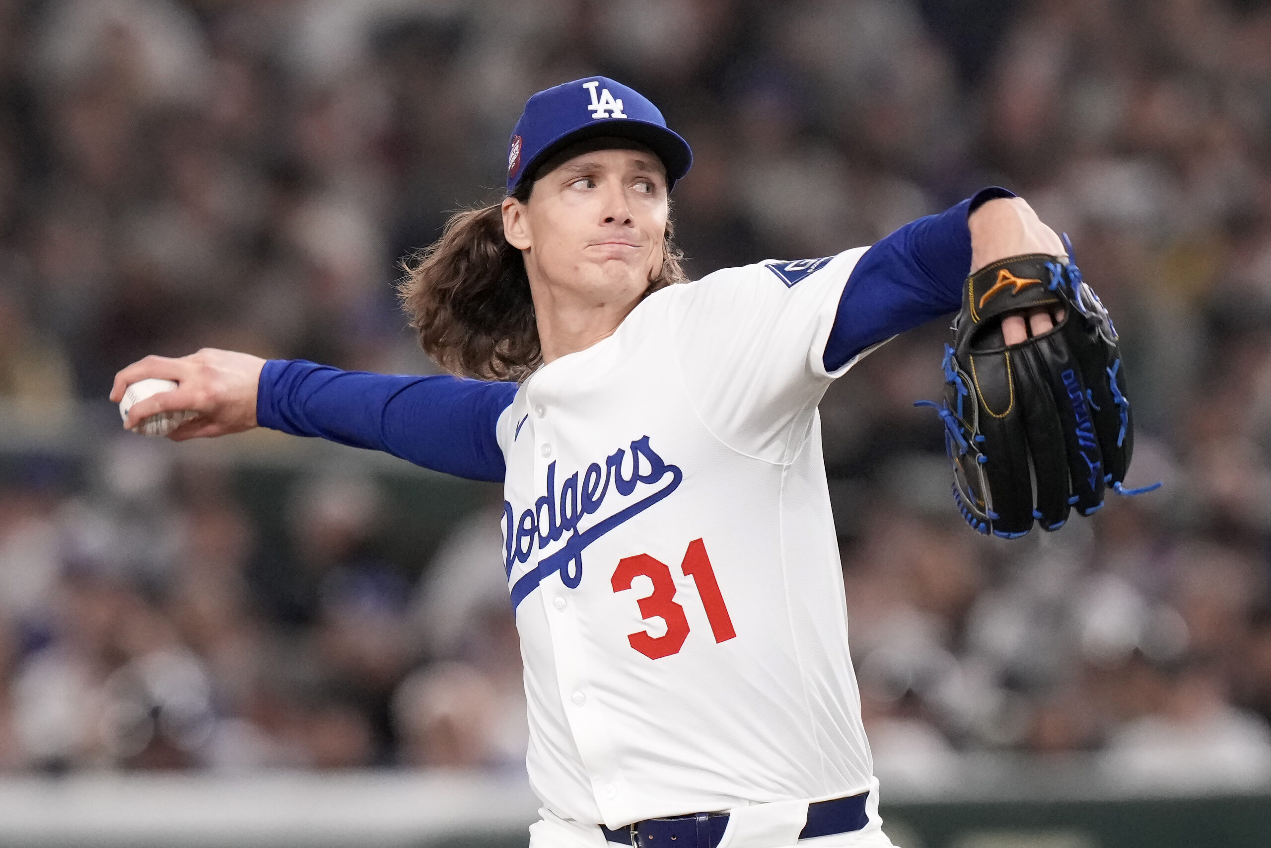 Dodgers pitcher Tyler Glasnow works against the Hanshin Tigers during...