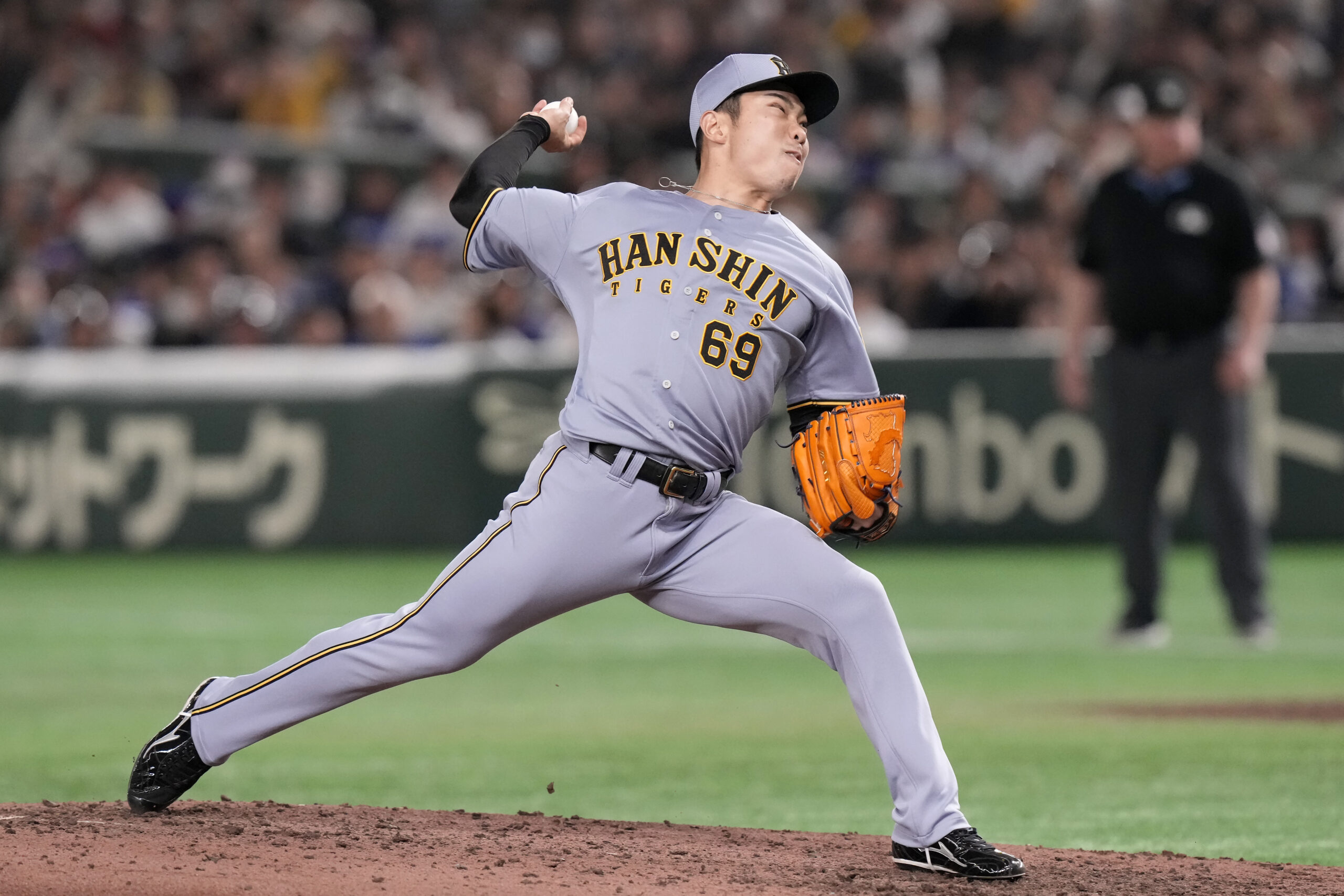 Hanshin Tigers pitcher Daichi Ishii works against the Dodgers during...