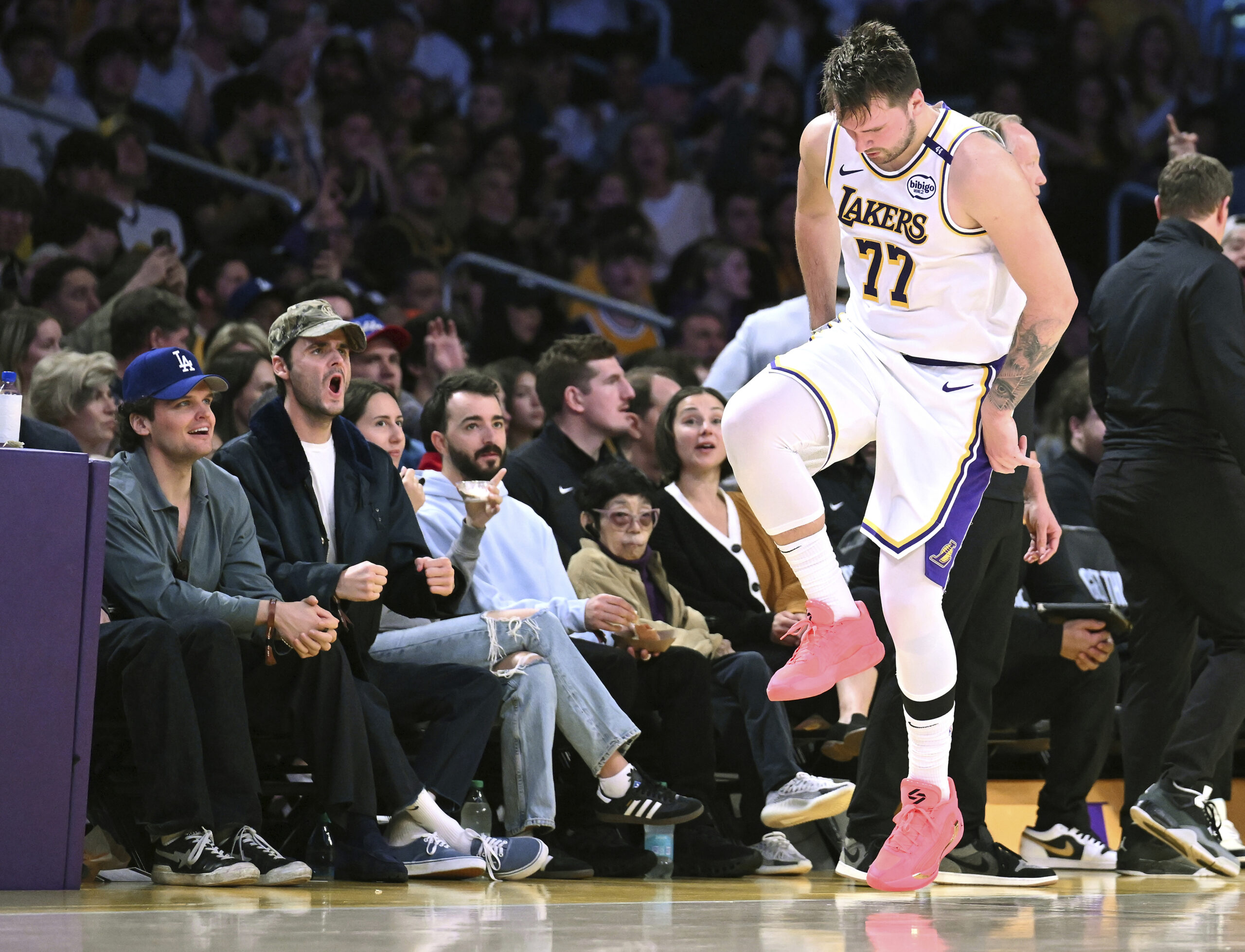 Lakers guard Luka Doncic (77) reacts after making a 3-point...