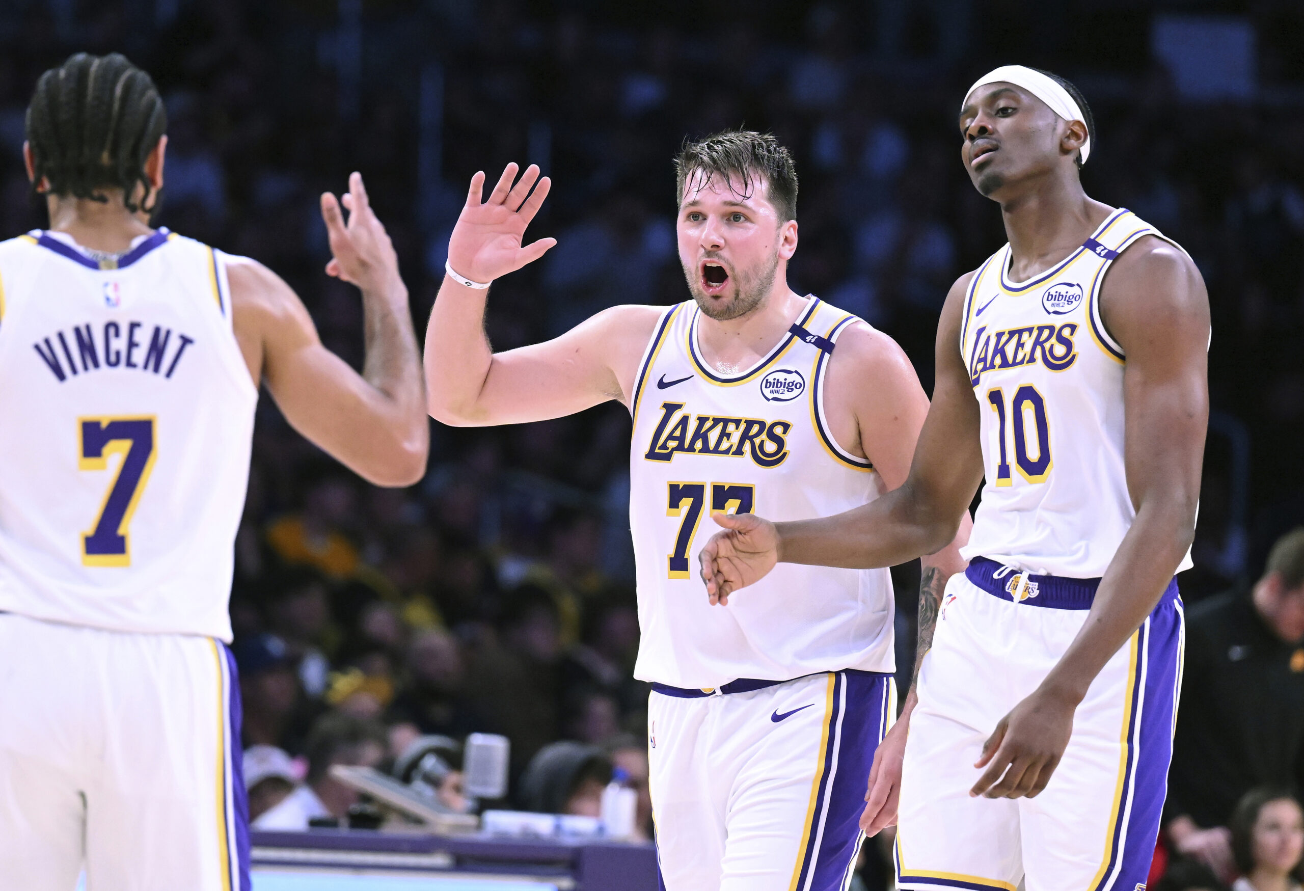 Lakers guard Luka Doncic (77) celebrates with guard Gabe Vincent...