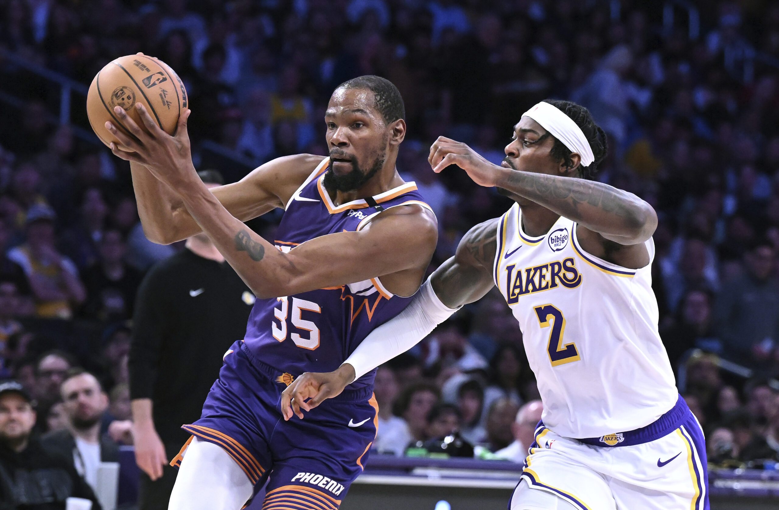 Phoenix Suns’ Kevin Durant (35) drives against Lakers forward Jarred...