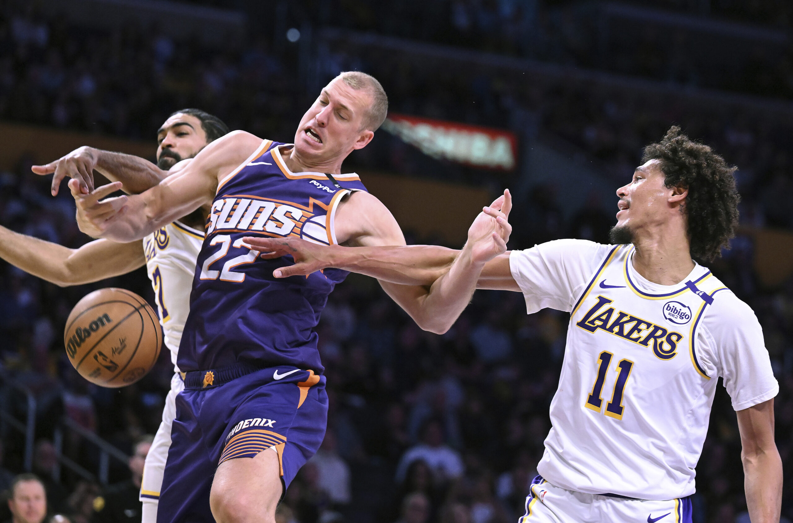 Phoenix Suns center Mason Plumlee (22) drives against Lakers guard...