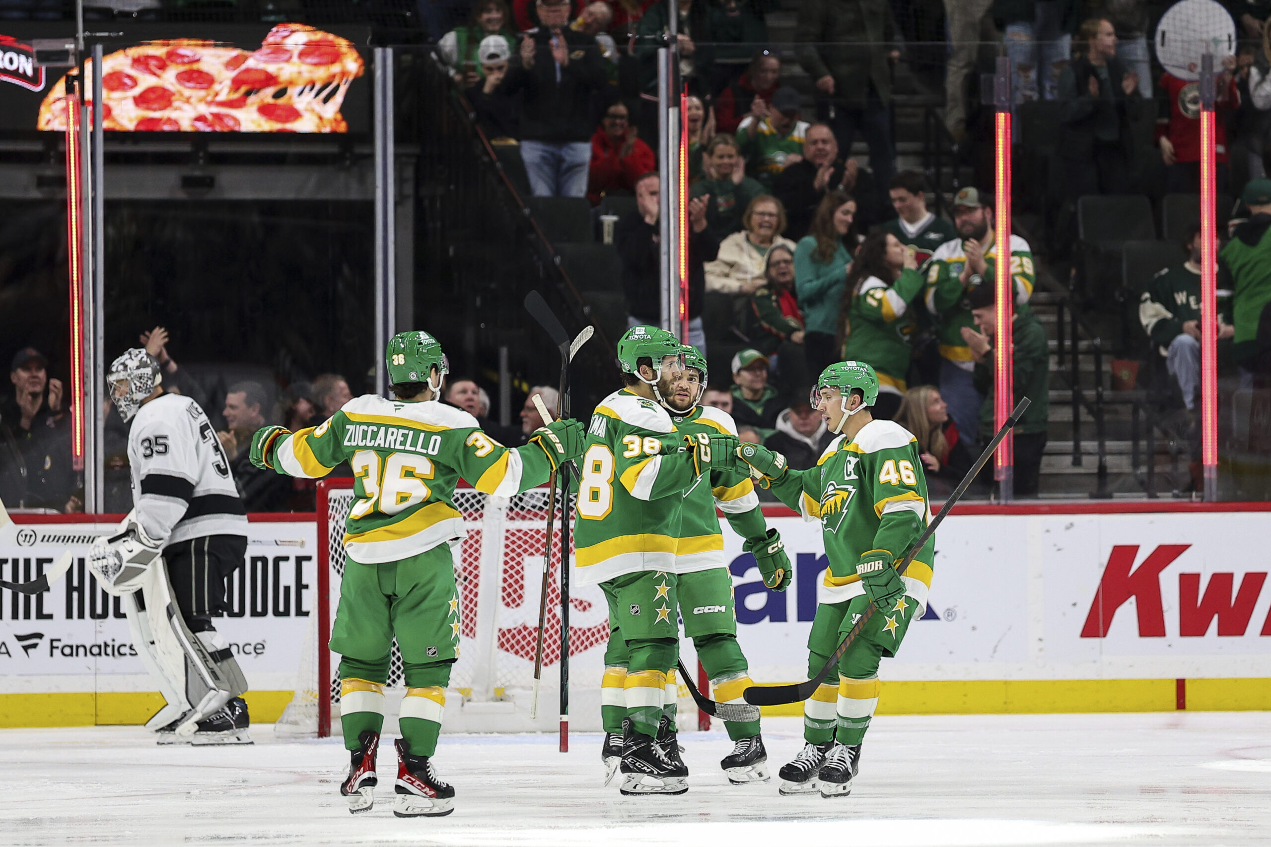 Minnesota Wild right wing Ryan Hartman (38) celebrates with teammates...