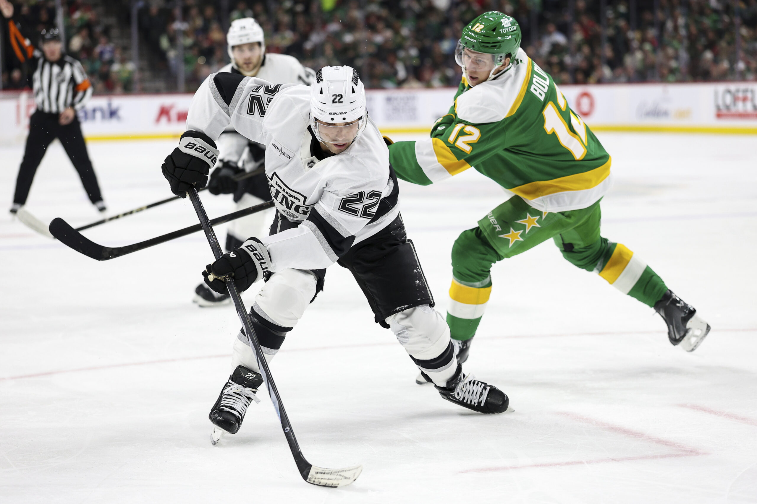 Kings left wing Kevin Fiala, front left, skates with the...