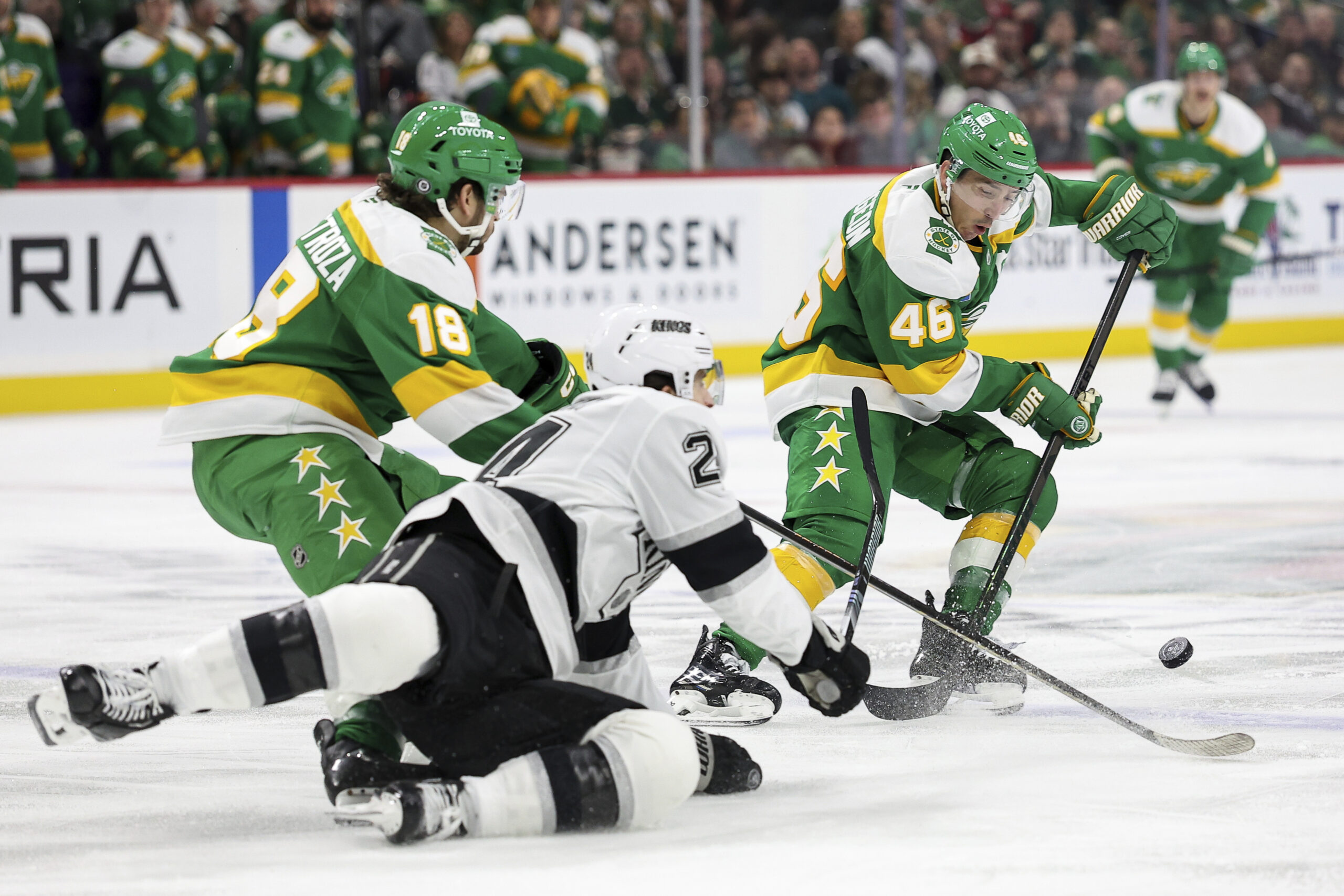 Minnesota Wild defenseman Jared Spurgeon, right, Wild center Vinnie Hinostroza...