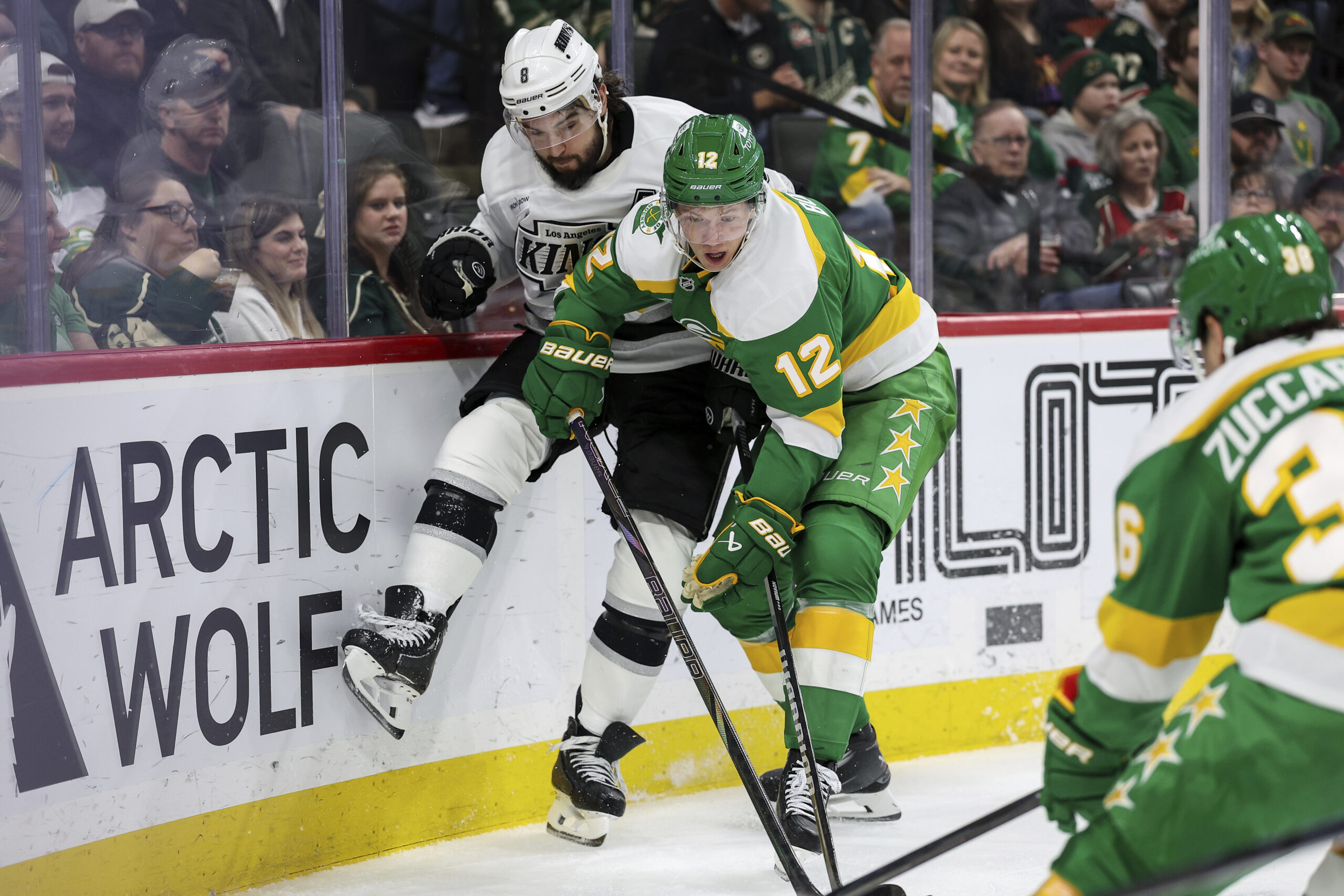 Minnesota Wild left wing Matt Boldy (12) and Kings defenseman...