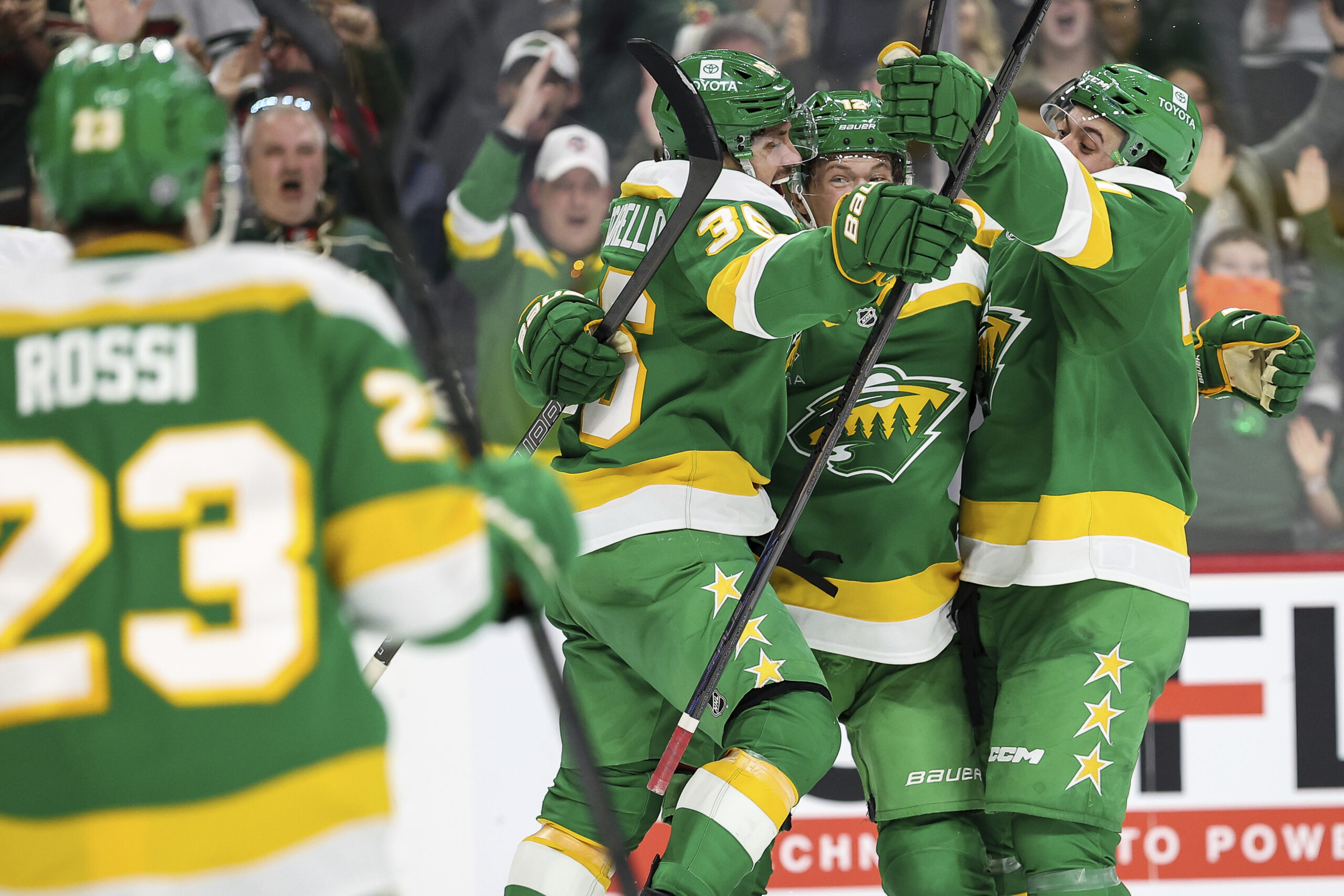 Minnesota Wild right wing Mats Zuccarello, third from right, celebrates...