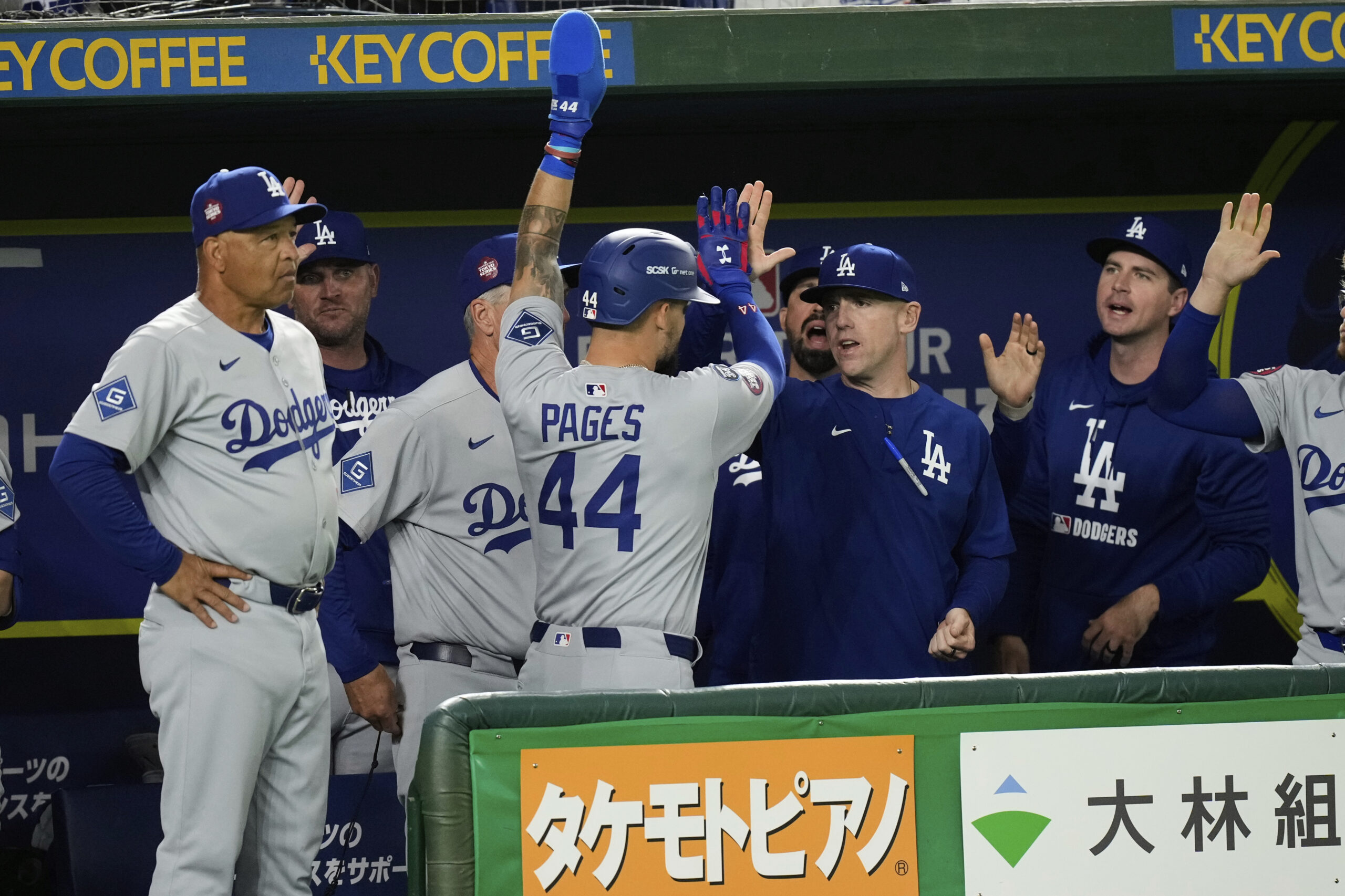 Los Angeles Dodgers’ Andy Pages, front center, celebrates with teammates...