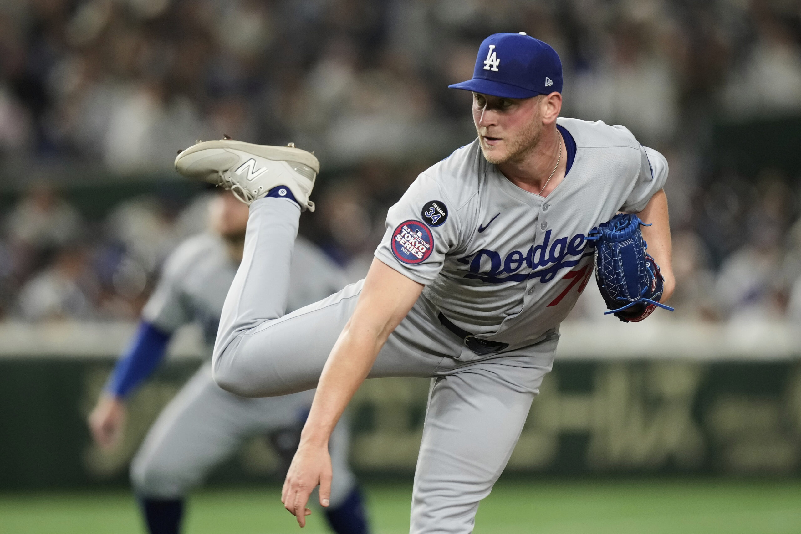 Los Angeles Dodgers relief pitcher Ben Casparius works against the...