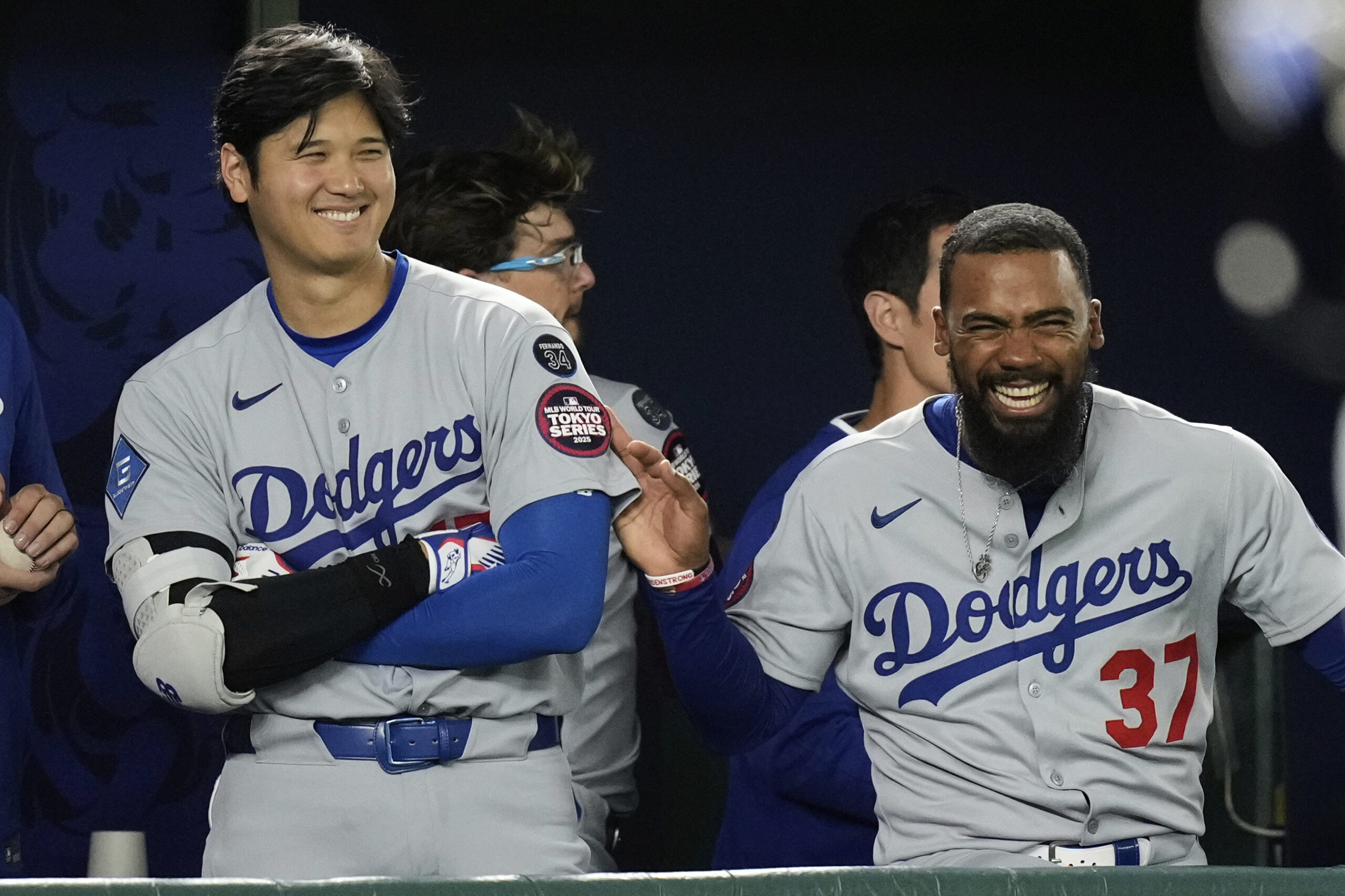 Los Angeles Dodgers’ Shohei Ohtani, left, and Teoscar Hernandez, right,...