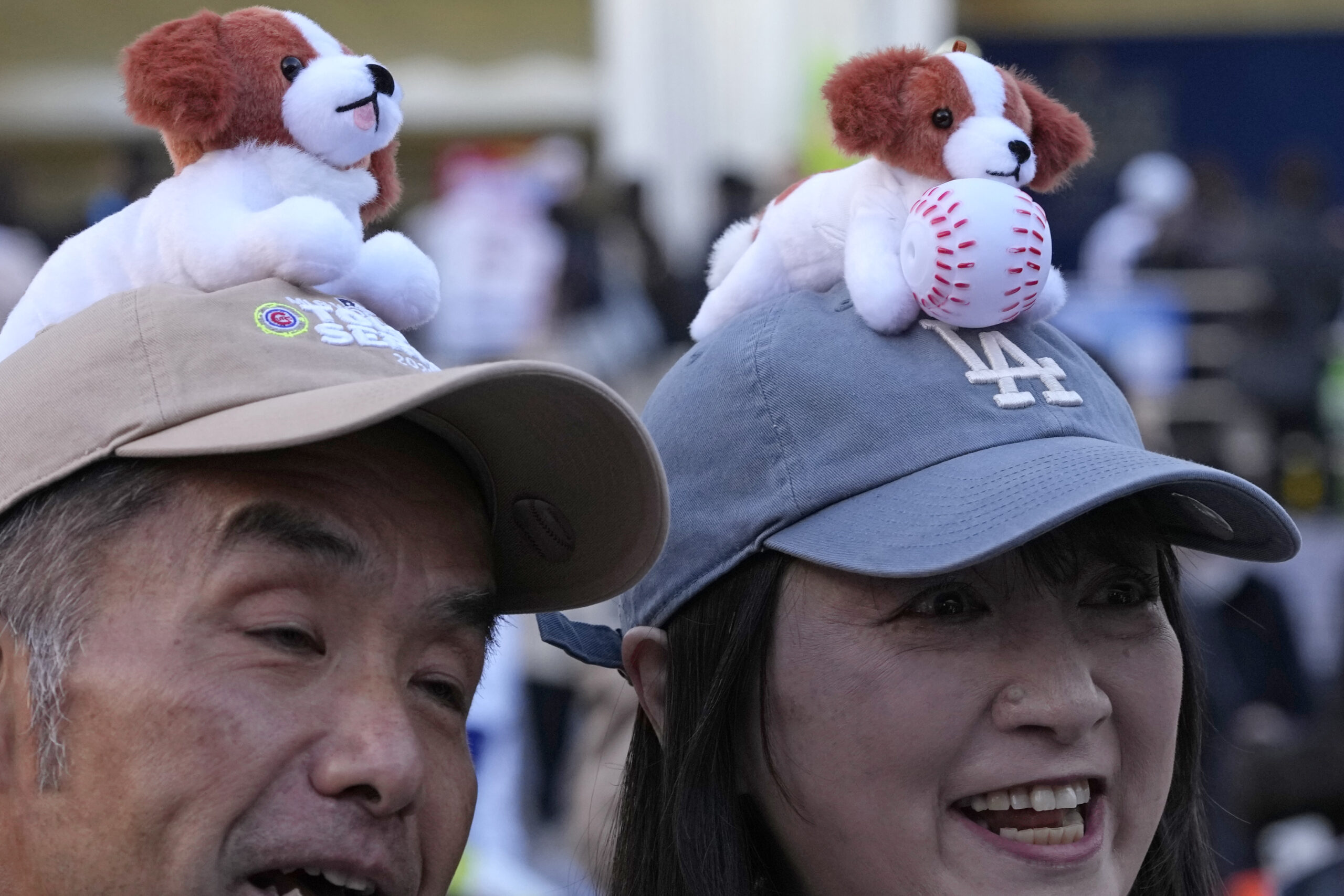 A couple wears cap featuring the pet dog of Los...