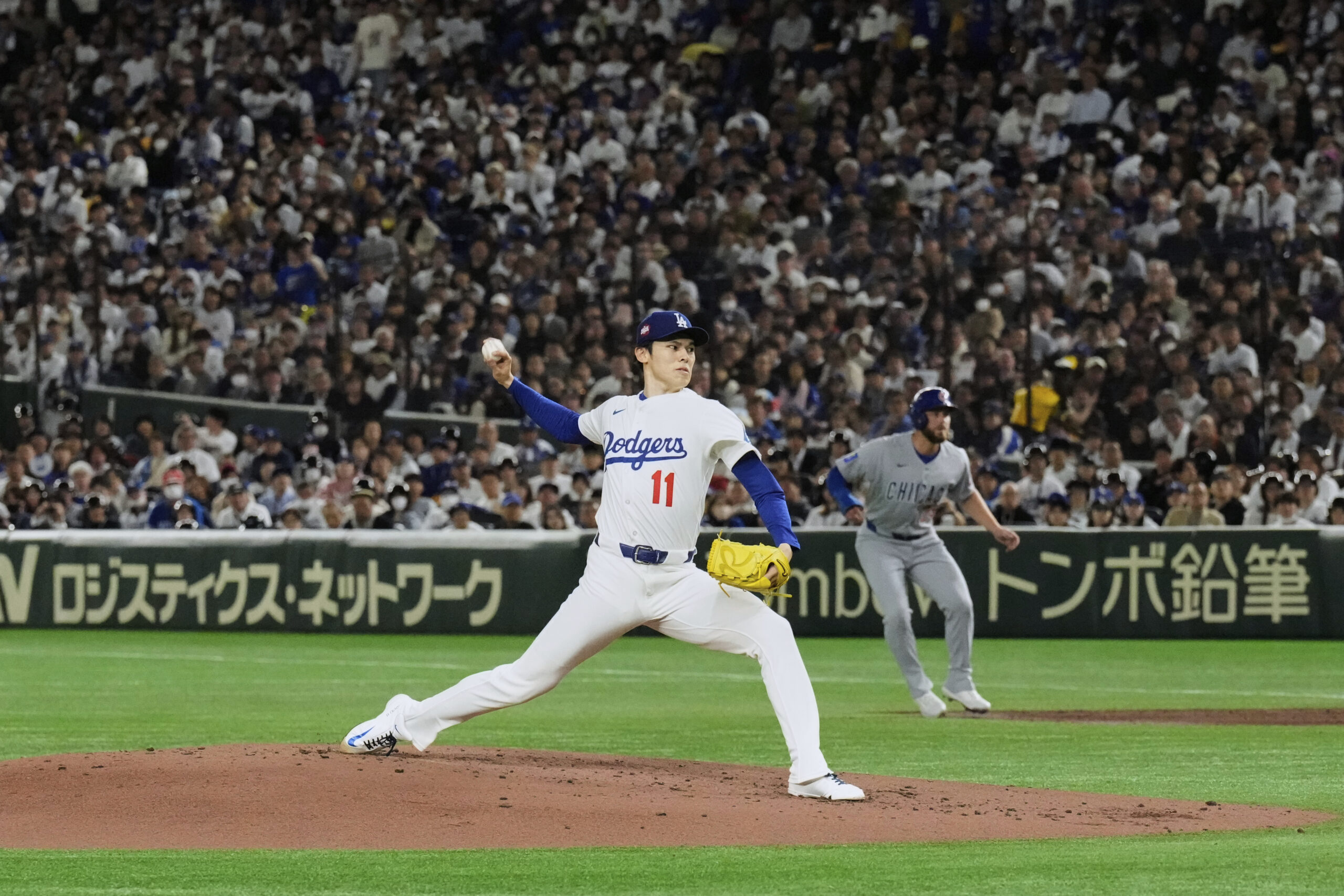 Dodgers pitcher Roki Sasaki throws to the Chicago Cubs in...