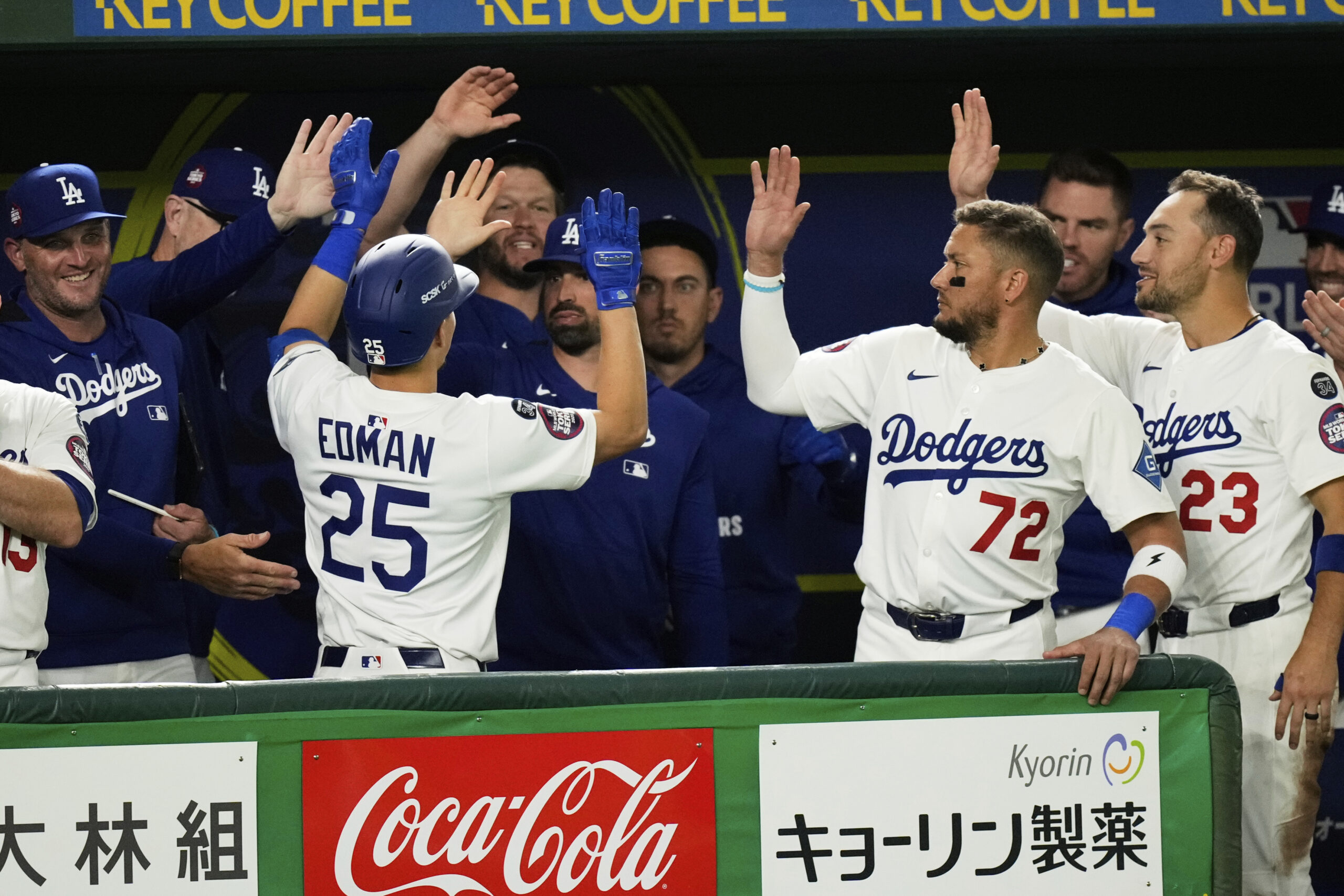 The Dodgers’ Tommy Edman (25) celebrates with the team in...