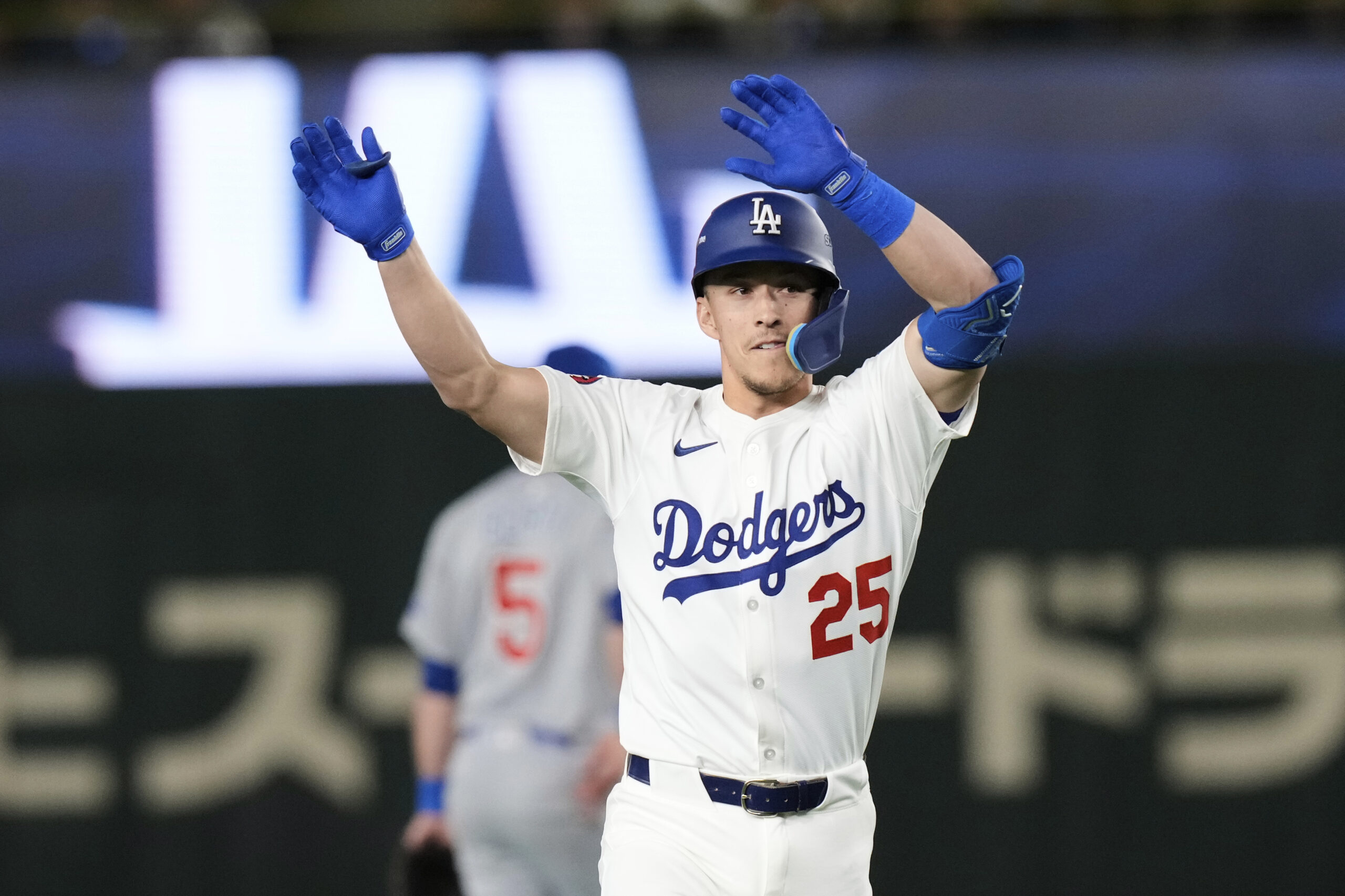 The Dodgers’ Tommy Edman celebrates his solo home run as...