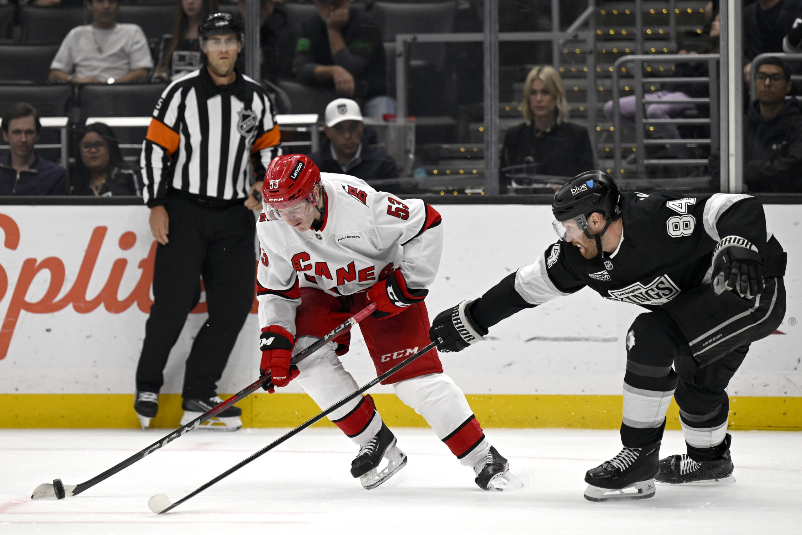 Carolina Hurricanes right wing Jackson Blake (53) controls the puck...