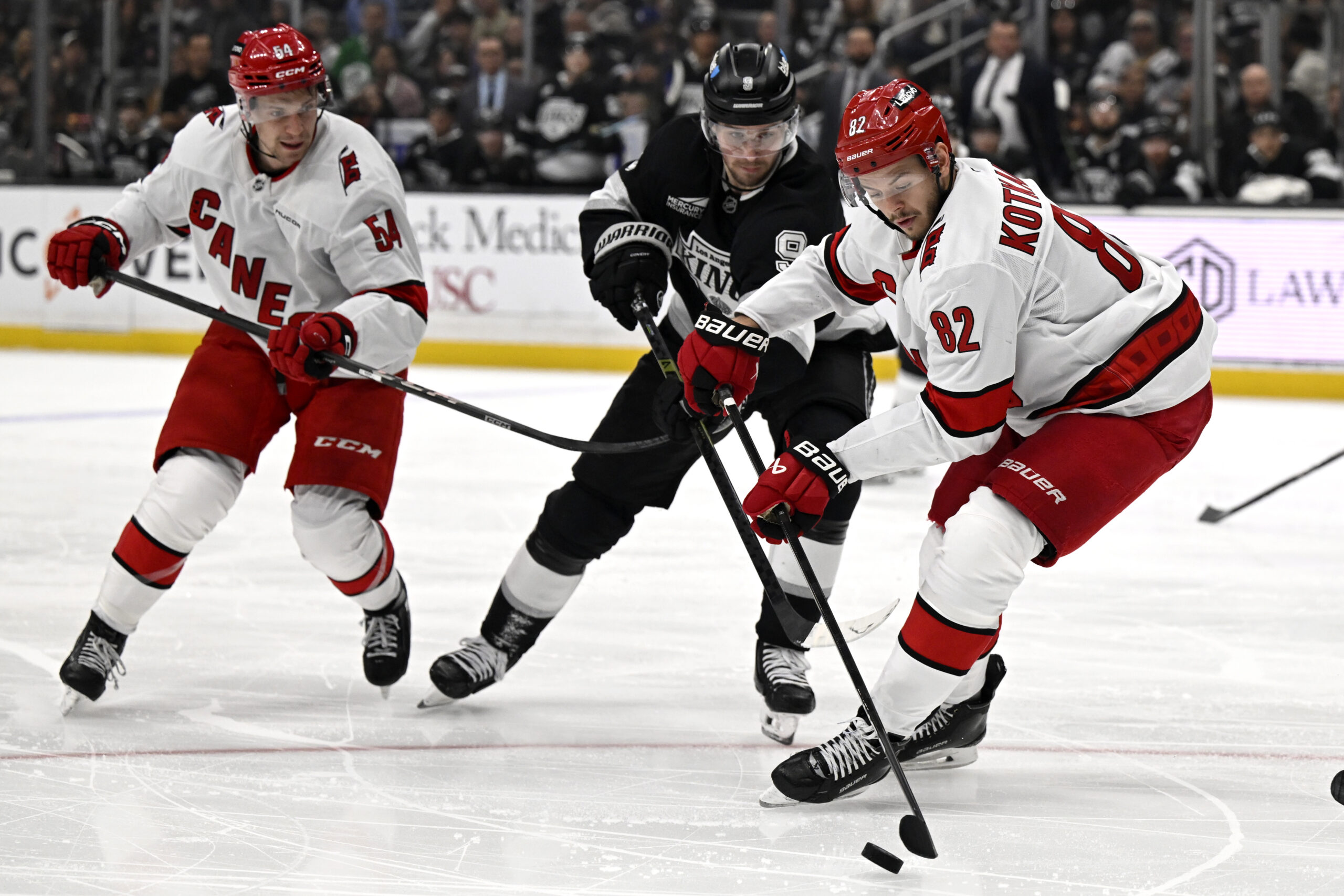 Carolina Hurricanes center Jesperi Kotkaniemi (82) controls the puck against...