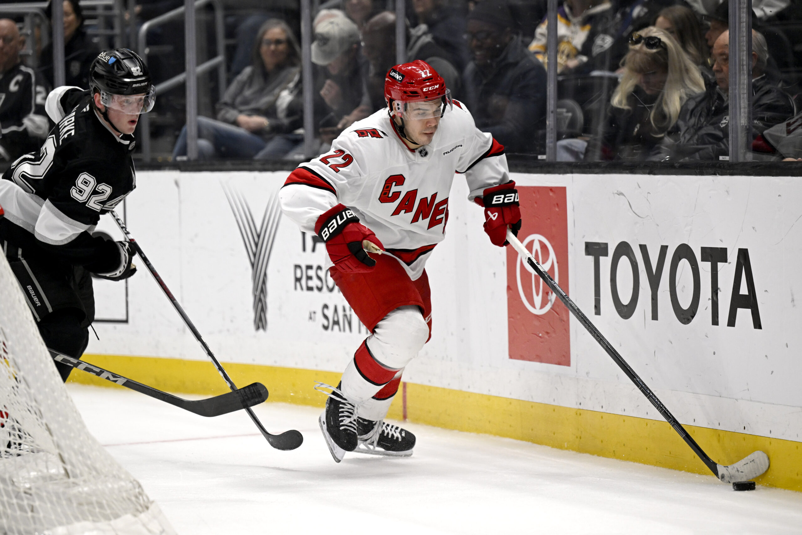 Carolina Hurricanes center Logan Stankoven (22) controls the puck with...